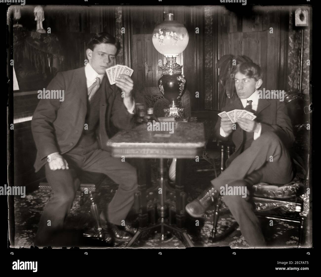 Two men in a poker card game in New York state, circa 1900. Image from