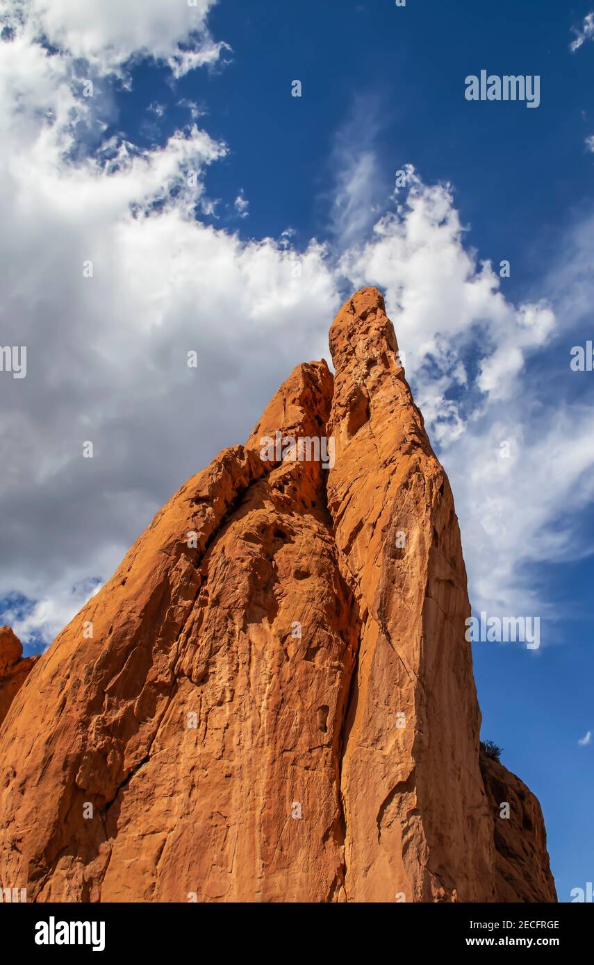 Reaching toward the heavens - Diminishing perspective of dramatic sandstone formation at Garden of the Gods near Rocky Mountains USA stretching into d Stock Photo