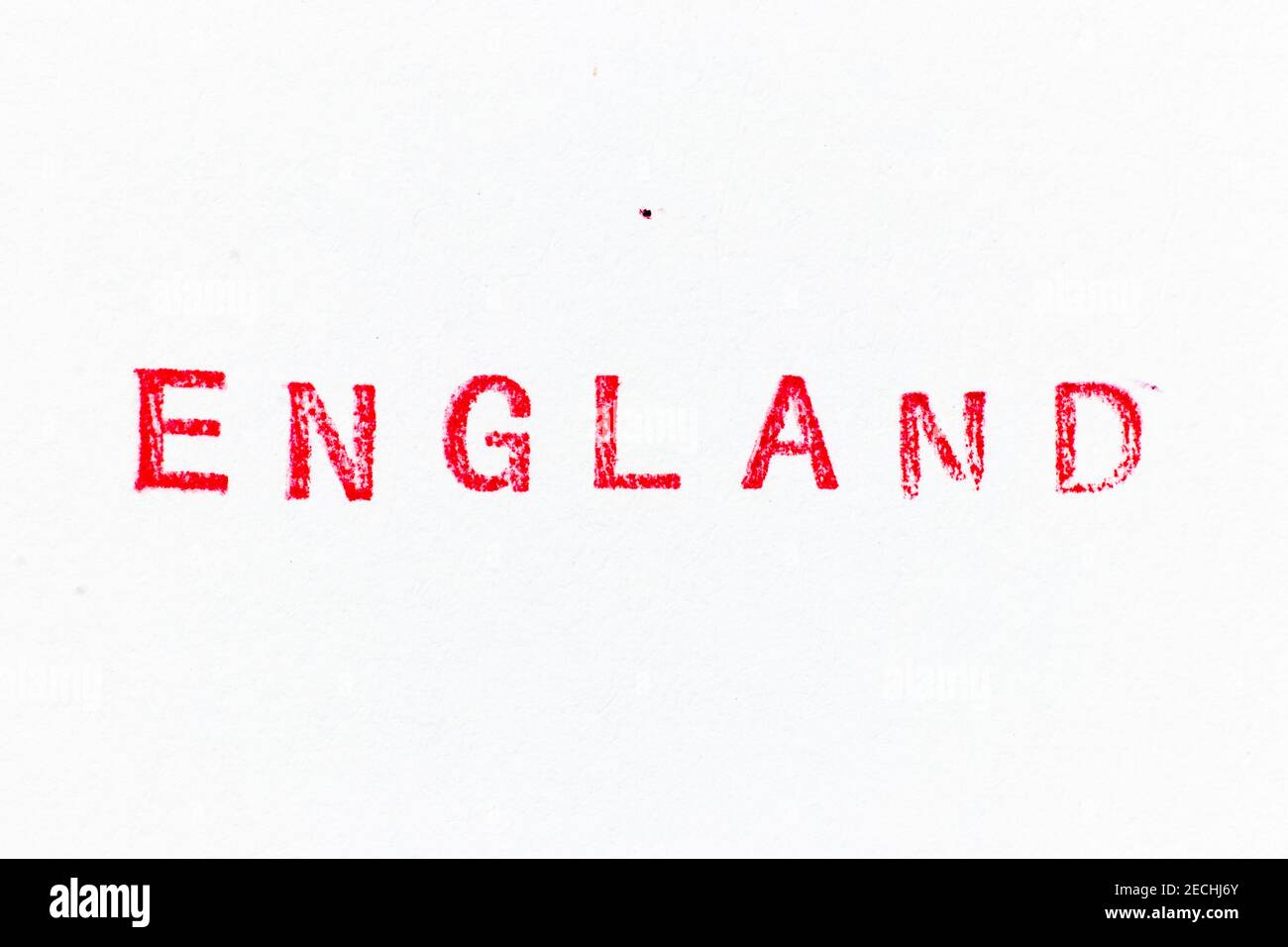 Red color ink rubber stamp in word england on white paper background ...