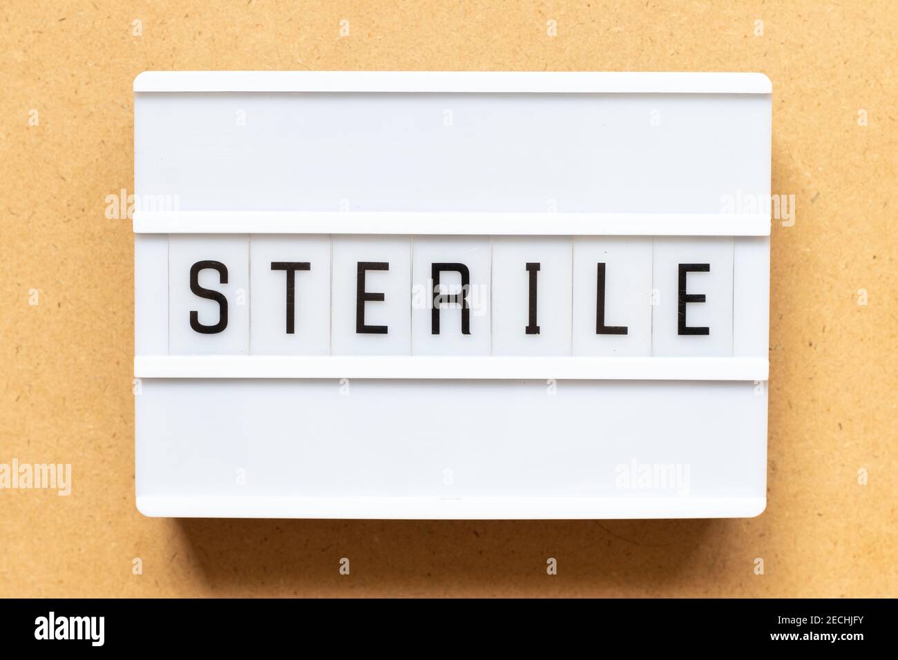 Lightbox with word sterile on wood background Stock Photo Alamy