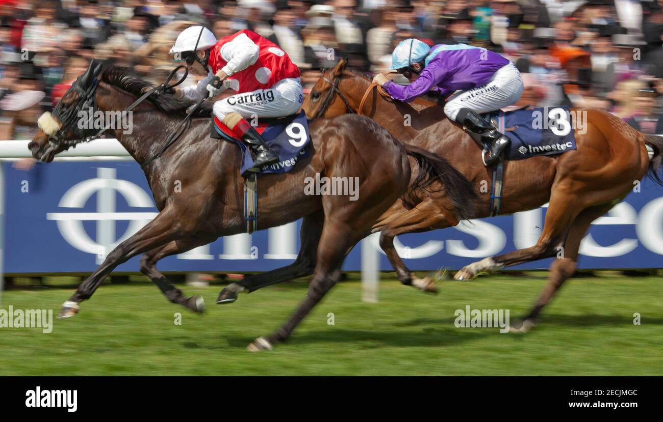 Horse Racing - Investec Derby Festival  - Epsom Racecourse - 2/6/12  Stone Of Folca ridden by Luke Morris lead Desert Law ridden by Jimy Fortune home to win the 15.15, The Investec Specialist Bank 'Dash'   Mandatory Credit: Action Images / Julian Herbert  Livepic Stock Photo