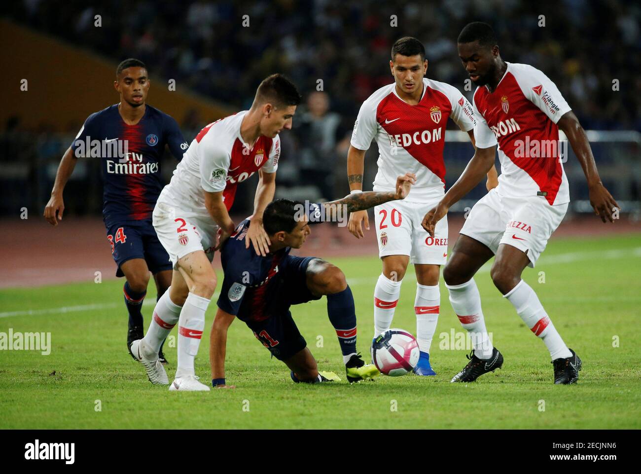 Soccer Football - French Super Cup Trophee des Champions - Paris St Germain v AS Monaco - Shenzhen Universiade Sports Centre, Shenzhen, China - August 4, 2018   Paris St Germain's Angel Di Maria in action with AS Monaco's Julien Serrano, Jean Eudes Aholou and Rony Lopes   REUTERS/Bobby Yip Stock Photo