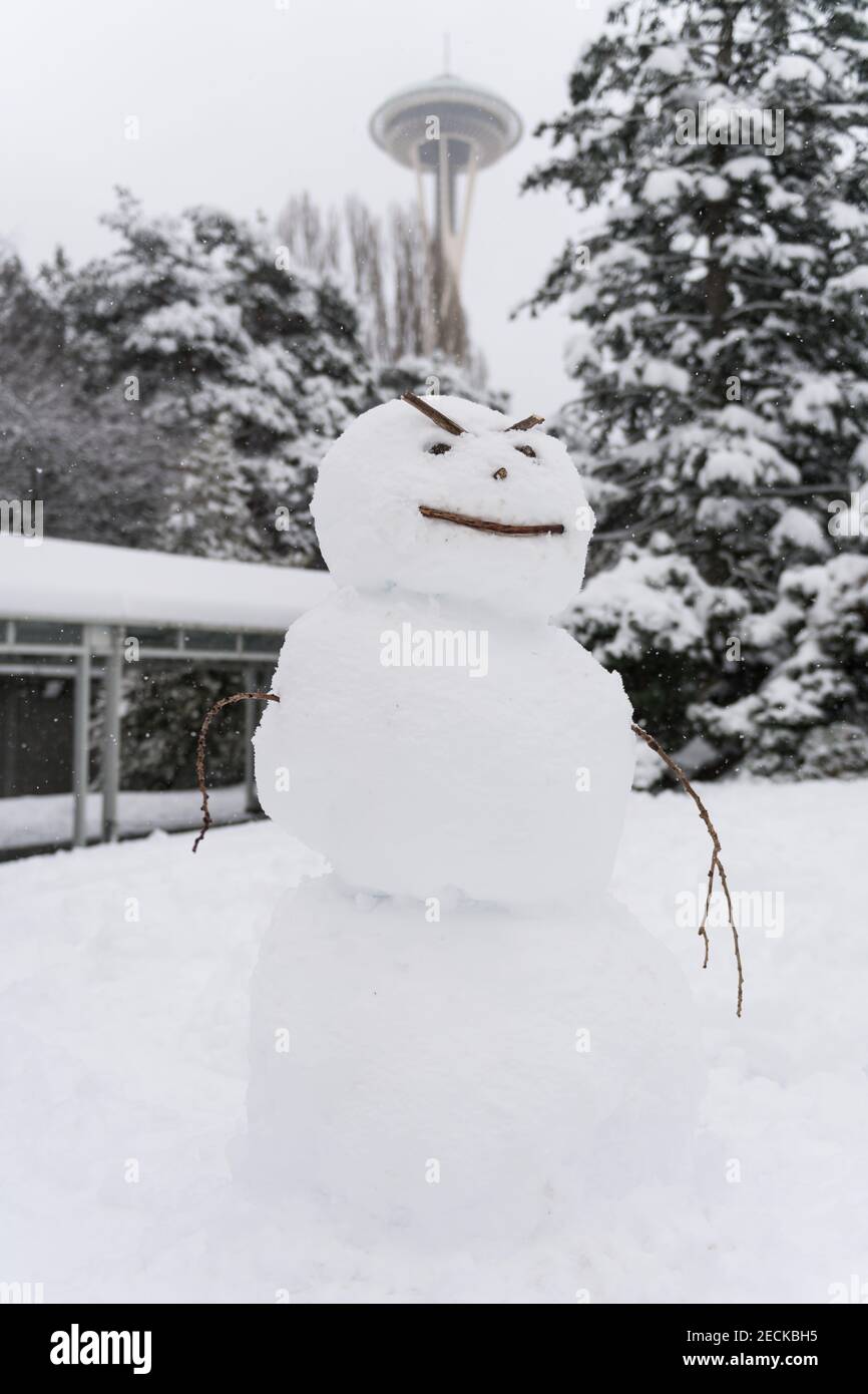 Seattle, USA. 13th Feb, 2021. Mid-day an angry Snowman at the Seattle Center during the first significant snow fall in downtown. Credit: James Anderson/Alamy Live News Stock Photo