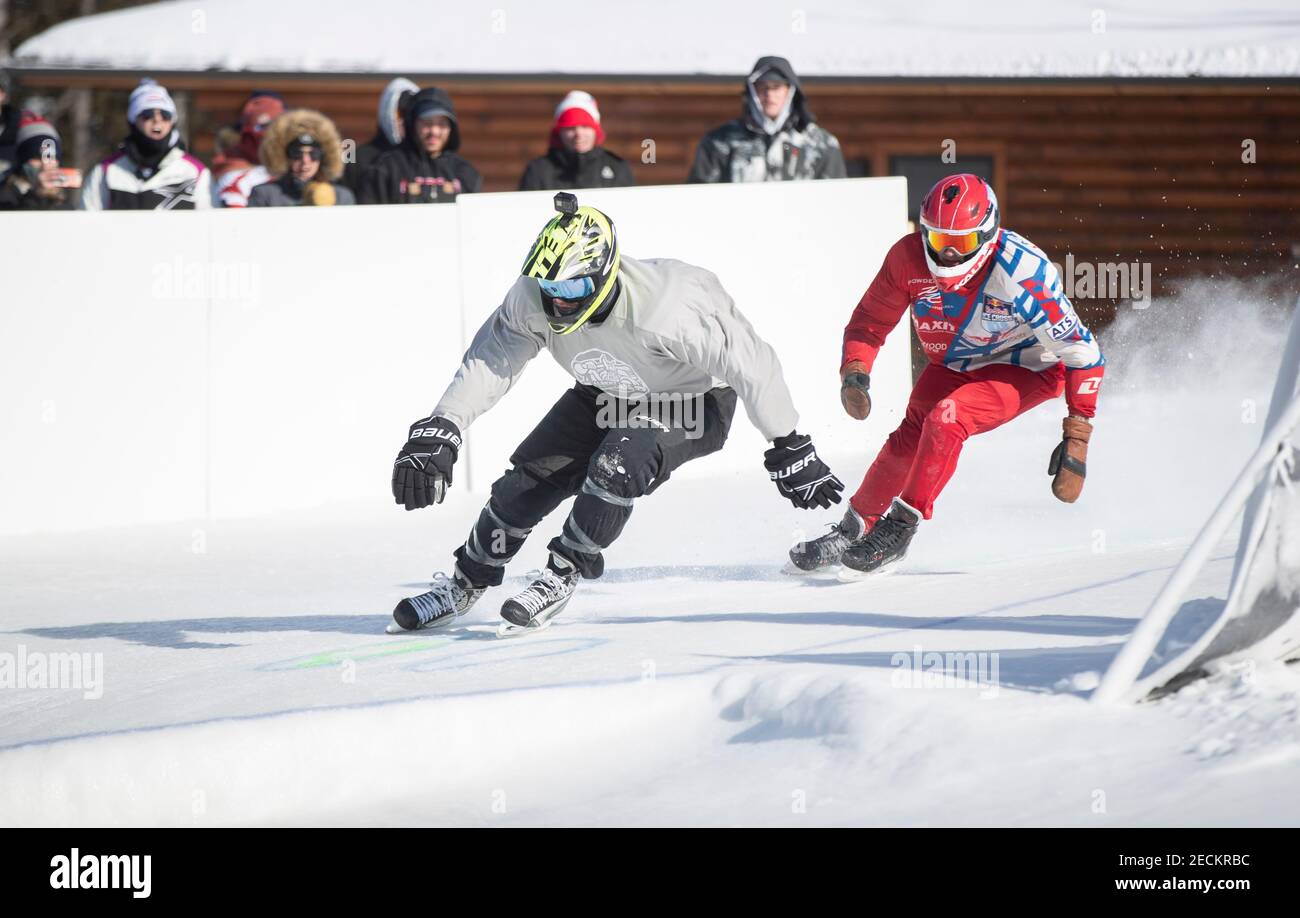 Superior, Wisconsin, USA. 13th Feb, 2021. Skaters go arond one of the