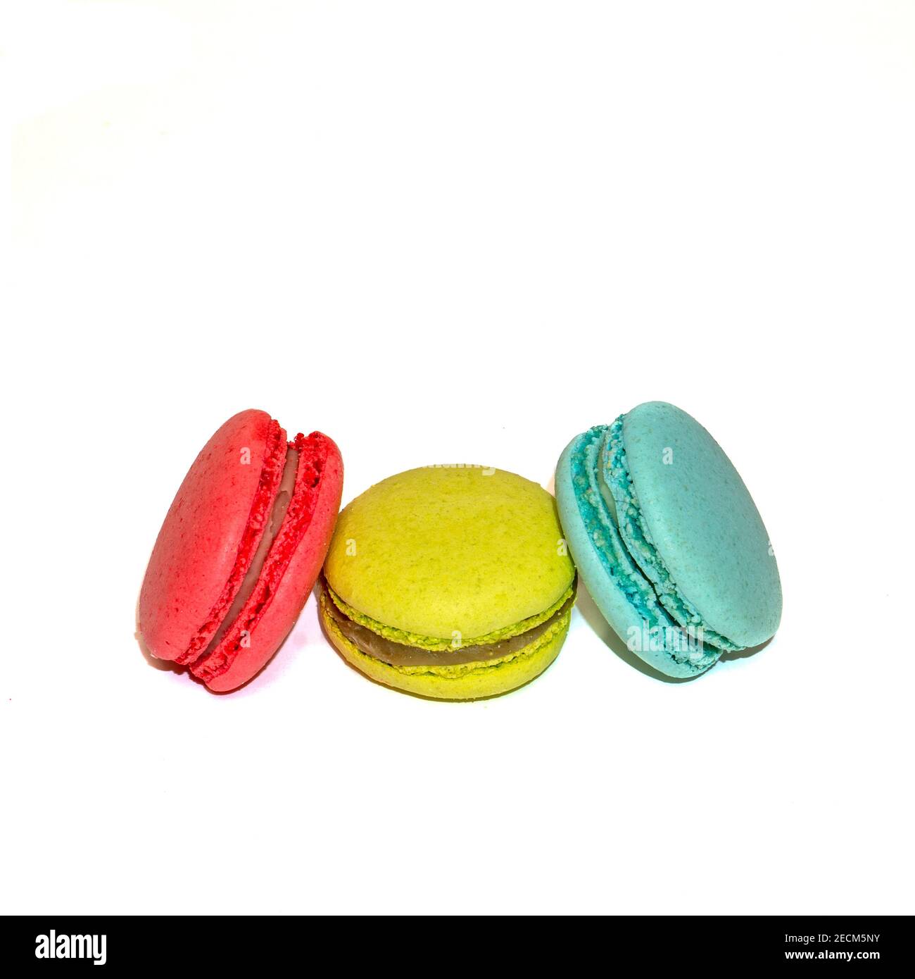 Macaroons isolated in white background. Colorful french macarons close-up. Tasty sweet color macaroon, bakery concept.  Stock Photo