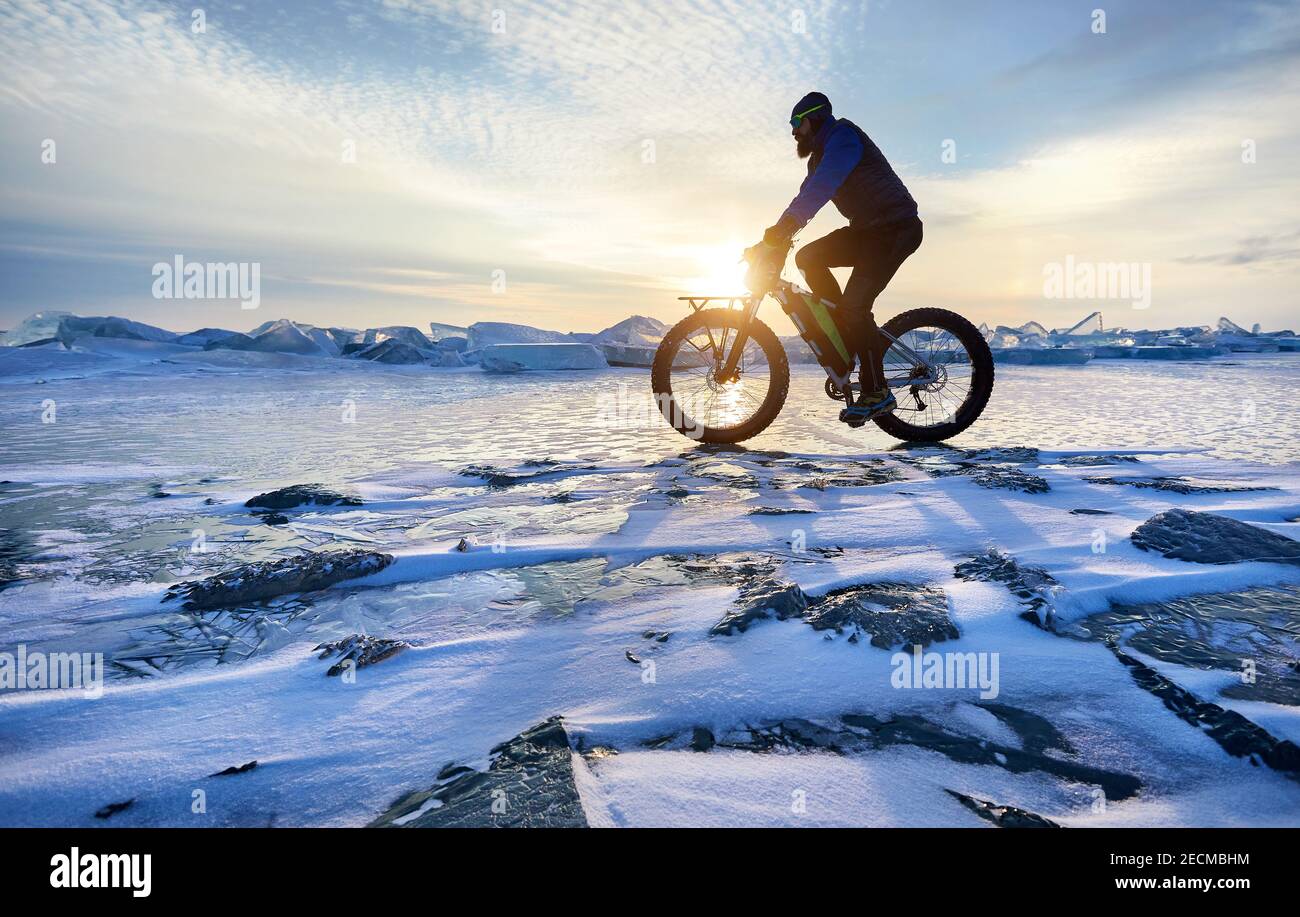 Man ride fat bike at frozen lake Kapchagay in Kazakhstan Stock Photo Alamy