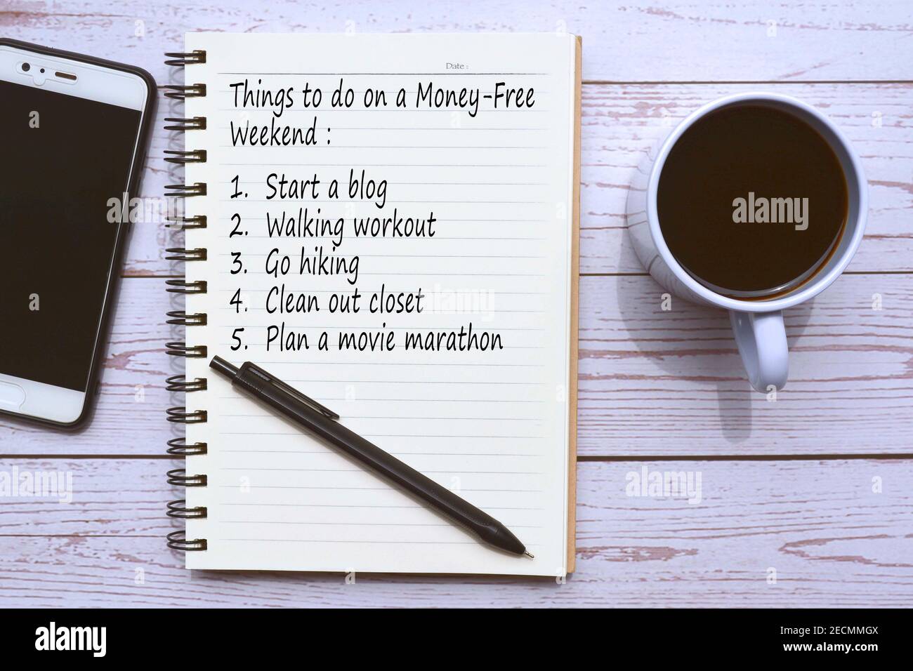 Checklist text on notepad on wooden background Stock Photo - Alamy
