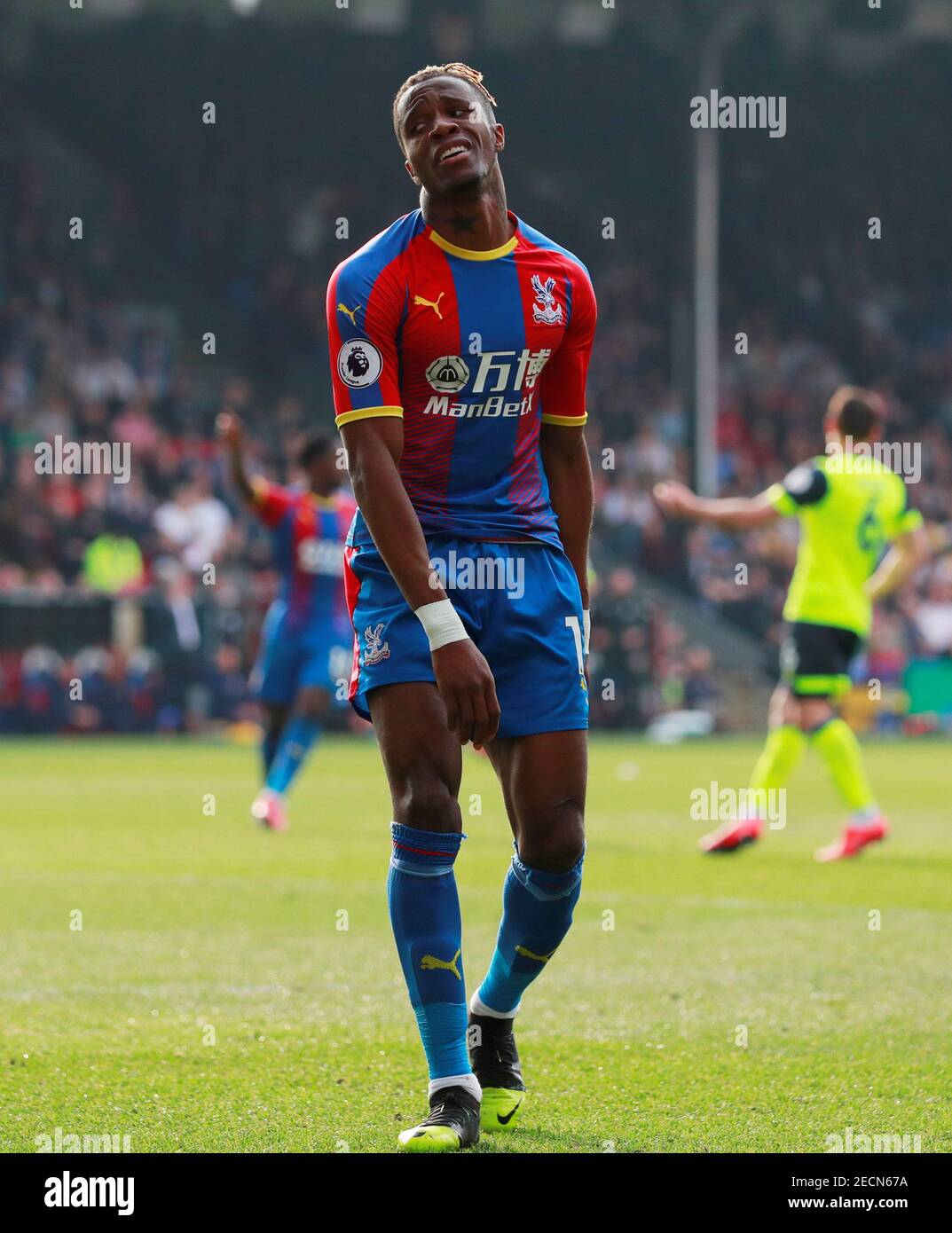 Soccer Football - Premier League - Crystal Palace v Huddersfield Town - Selhurst Park, London, Britain - March 30, 2019  Crystal Palace's Wilfried Zaha reacts during the match    Action Images via Reuters/Andrew Couldridge  EDITORIAL USE ONLY. No use with unauthorized audio, video, data, fixture lists, club/league logos or 'live' services. Online in-match use limited to 75 images, no video emulation. No use in betting, games or single club/league/player publications.  Please contact your account representative for further details. Stock Photo