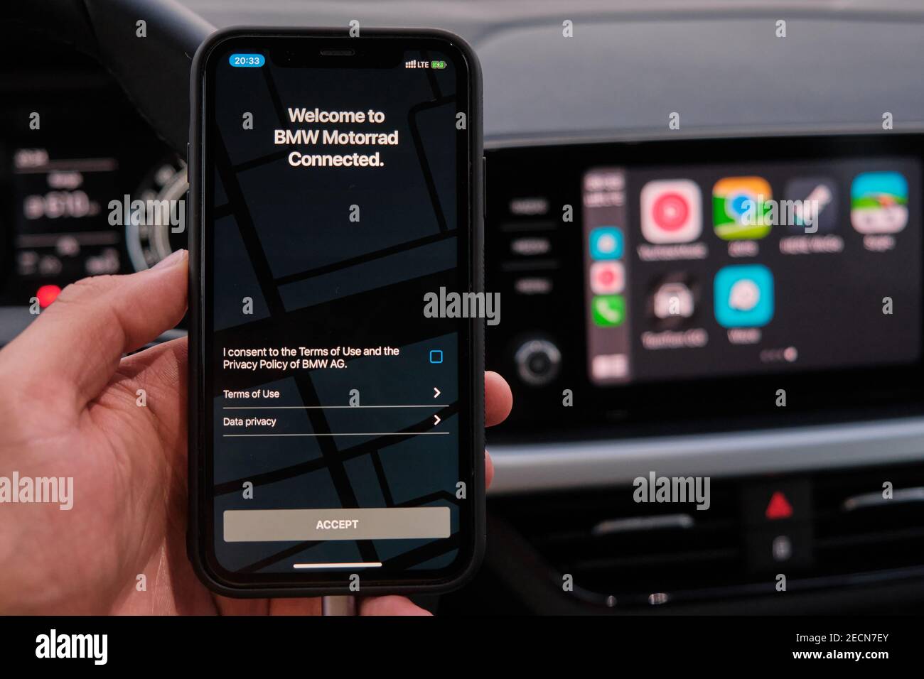 Welcome to BMW Motorrad connected on the screen of smart phone in mans hand  on the background of car dashboard screen with application of navigation  Stock Photo - Alamy