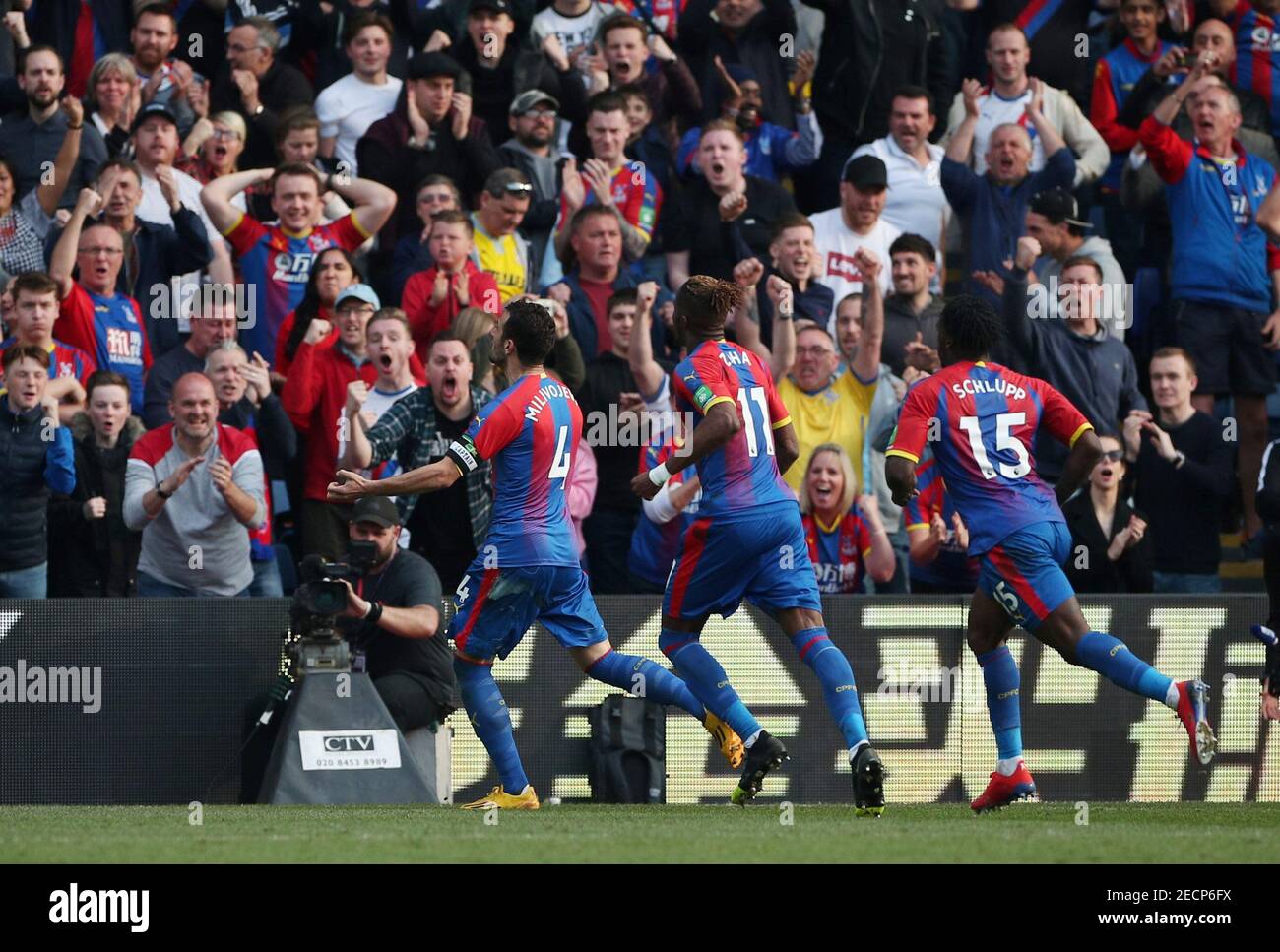Soccer Football - Premier League - Crystal Palace v Huddersfield Town - Selhurst Park, London, Britain - March 30, 2019  Crystal Palace's Luka Milivojevic celebrates scoring their first goal with team mates     REUTERS/Hannah McKay  EDITORIAL USE ONLY. No use with unauthorized audio, video, data, fixture lists, club/league logos or "live" services. Online in-match use limited to 75 images, no video emulation. No use in betting, games or single club/league/player publications.  Please contact your account representative for further details. Stock Photo