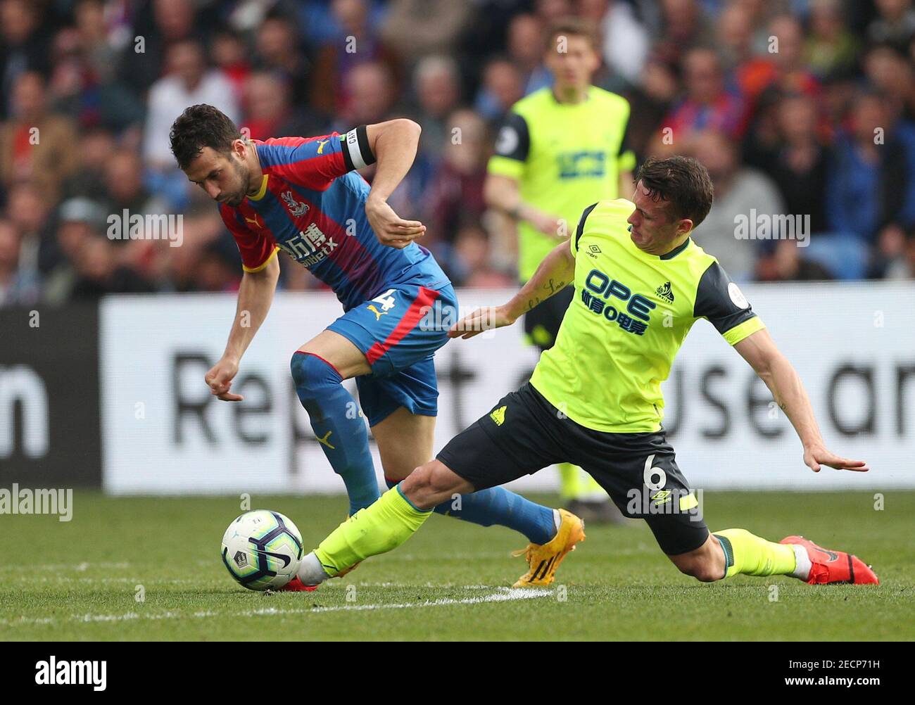 Soccer Football - Premier League - Crystal Palace v Huddersfield Town - Selhurst Park, London, Britain - March 30, 2019  Crystal Palace's Luka Milivojevic in action with Huddersfield Town's Jonathan Hogg   REUTERS/Hannah McKay  EDITORIAL USE ONLY. No use with unauthorized audio, video, data, fixture lists, club/league logos or "live" services. Online in-match use limited to 75 images, no video emulation. No use in betting, games or single club/league/player publications.  Please contact your account representative for further details. Stock Photo