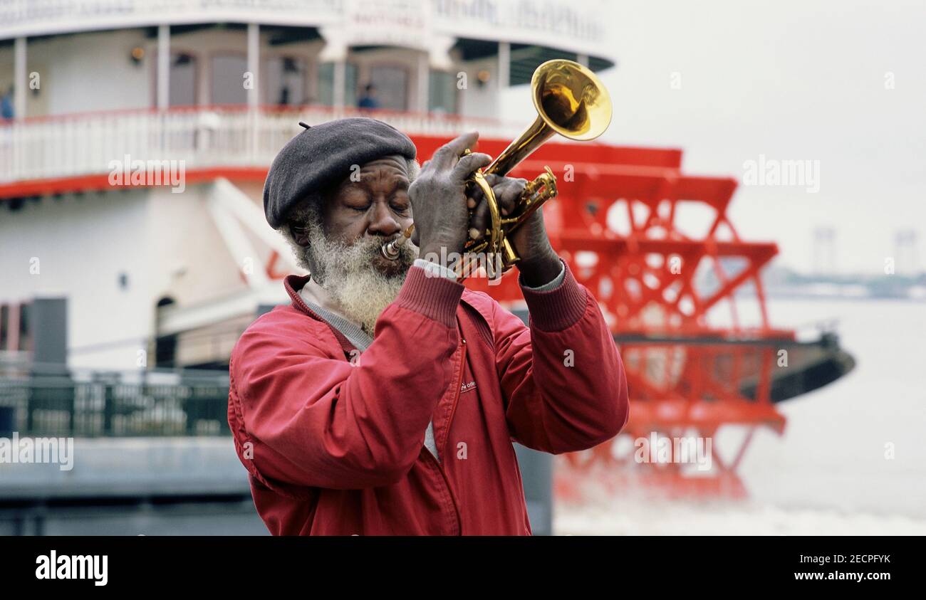 Jazz musician performing in front of a paddle wheeler boat Stock Photo