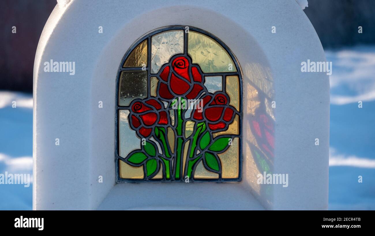 Marble tomb with red roses Stock Photo