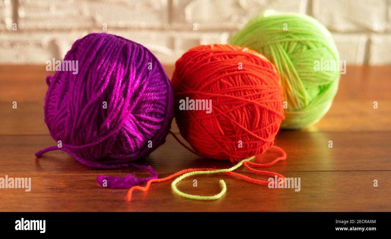 Clew of green thread for knitting isolated on white background Stock ...