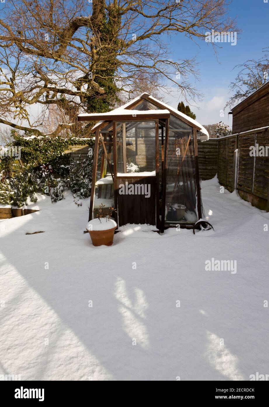 A snow covered greenhouse Stock Photo
