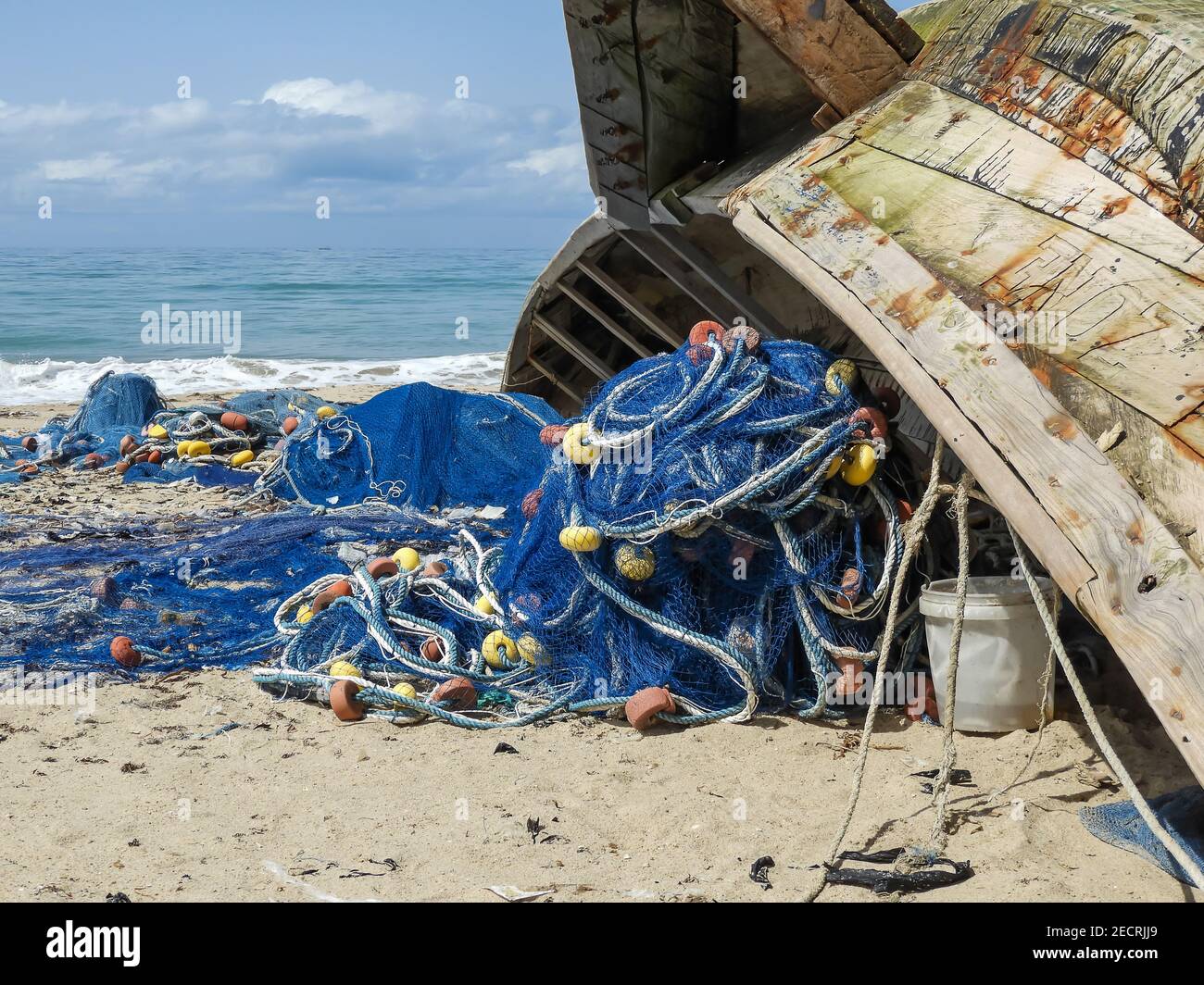 Fishing boat and fish net in Ada Foah Ghana. After night work on sea. Stock Photo