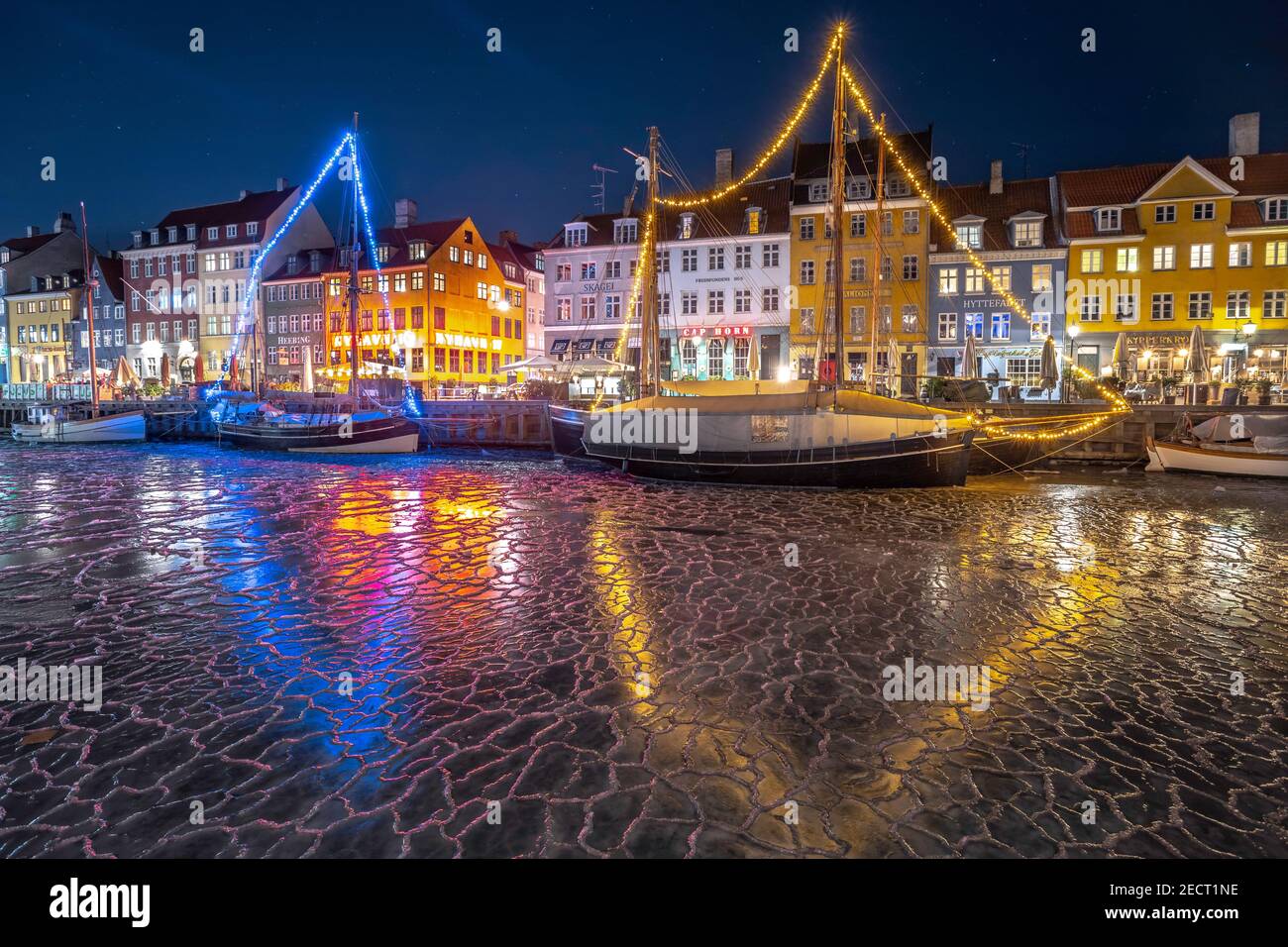 Copenhagen lights festival at night in Nyhavn with the frozen canal,  Denmark Stock Photo - Alamy