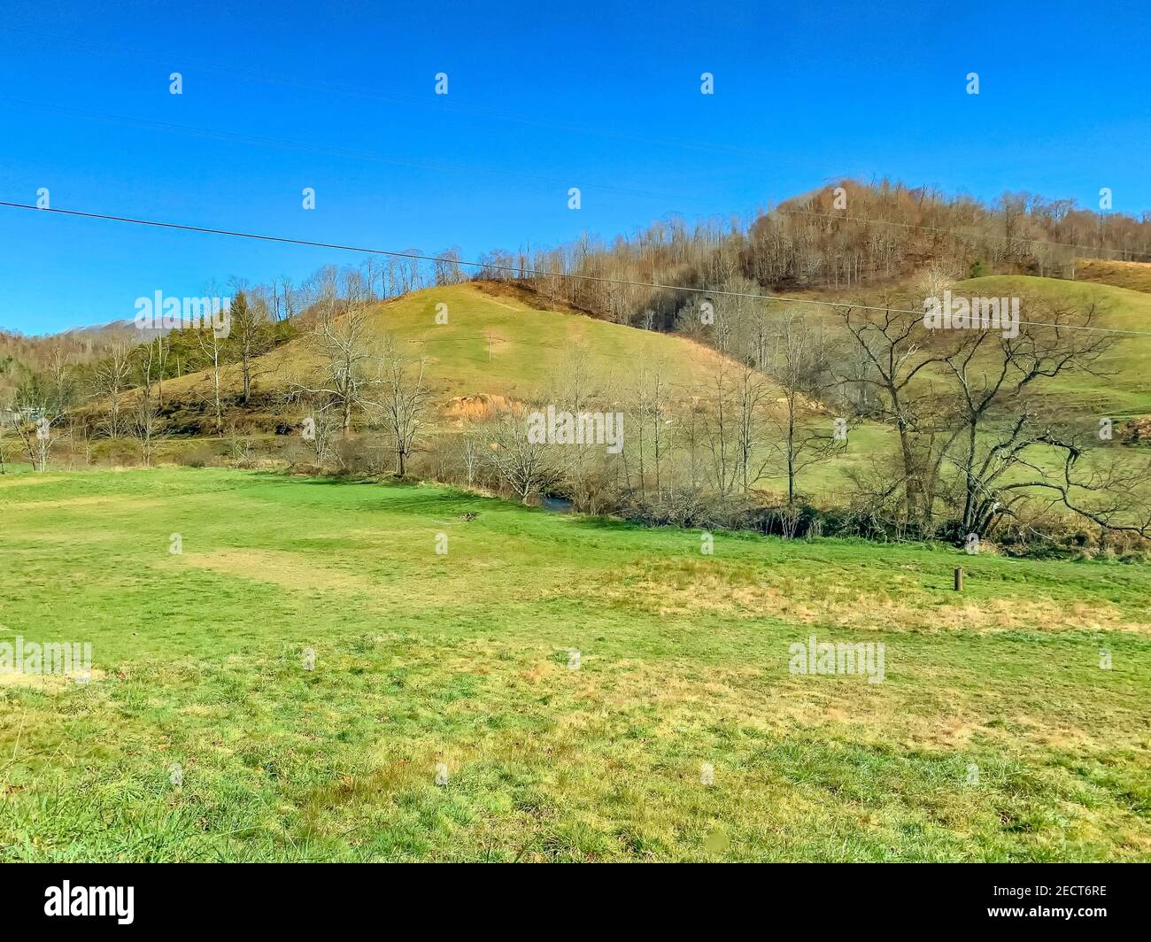 Hilly Rural Rural country hill with grass and sky Stock Photo - Alamy