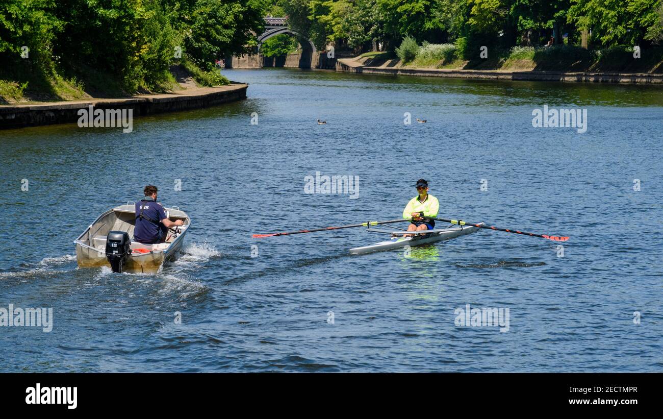 2 men in boats on sunny scenic River Ouse (sculler rowing single scull