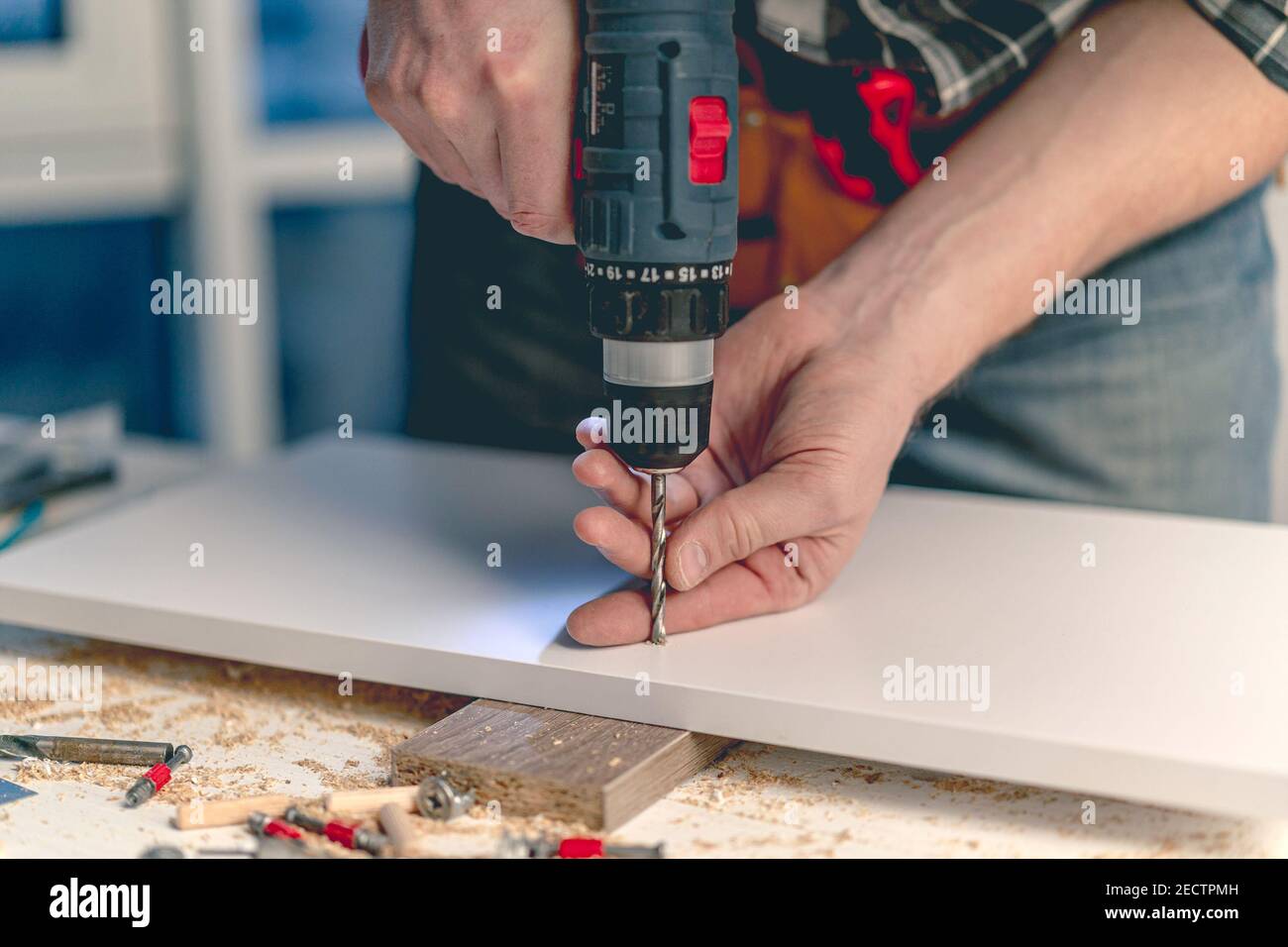 Man working during process of furniture manufacturing Stock Photo - Alamy