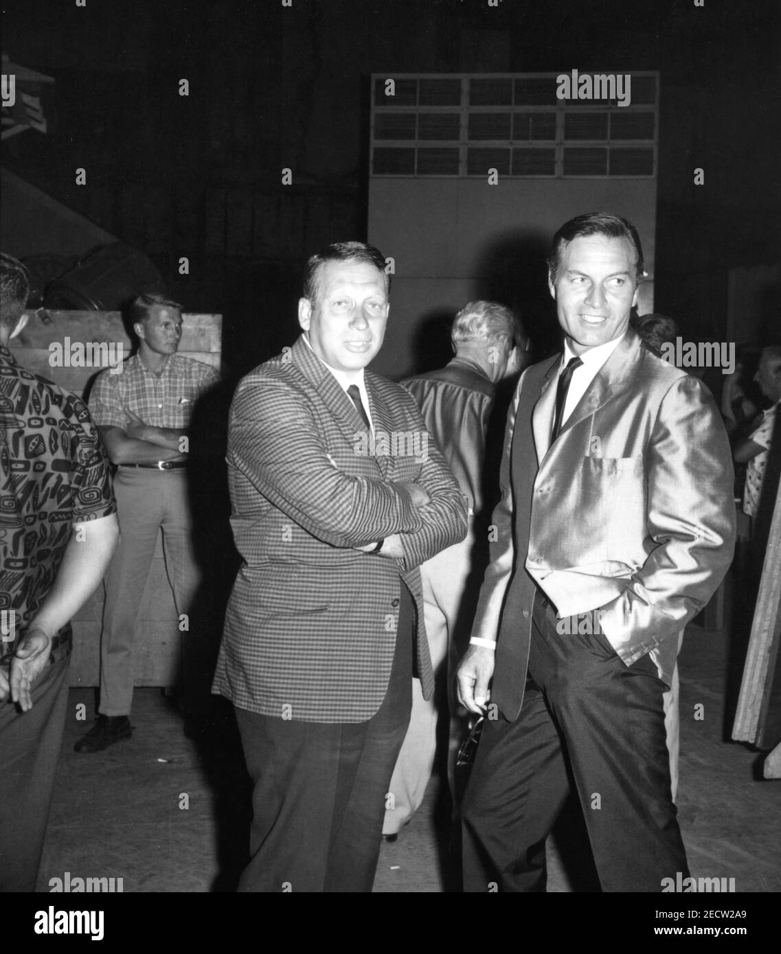 Producer HOWARD W. KOCH and Set Visitor GEORGE MONTGOMERY on set candid during filming of SERGEANTS 3 / SERGEANTS THREE 1962 director JOHN STURGES Essex Productions / Meadway-Claude Productions Company / United Artists Stock Photo