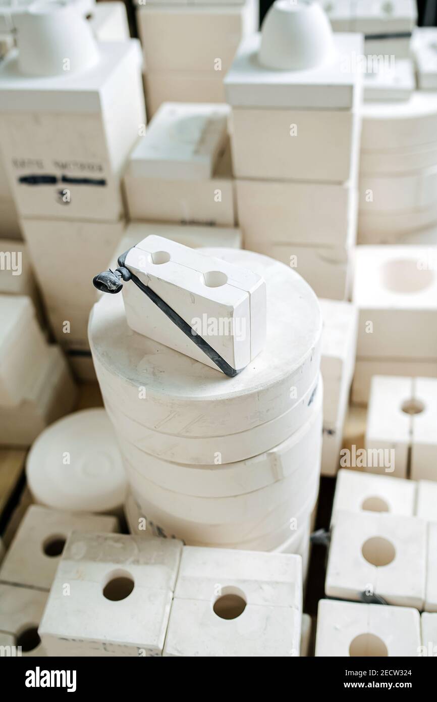 High angle view on a stack of molds for casting tableware of different shape. Stock Photo