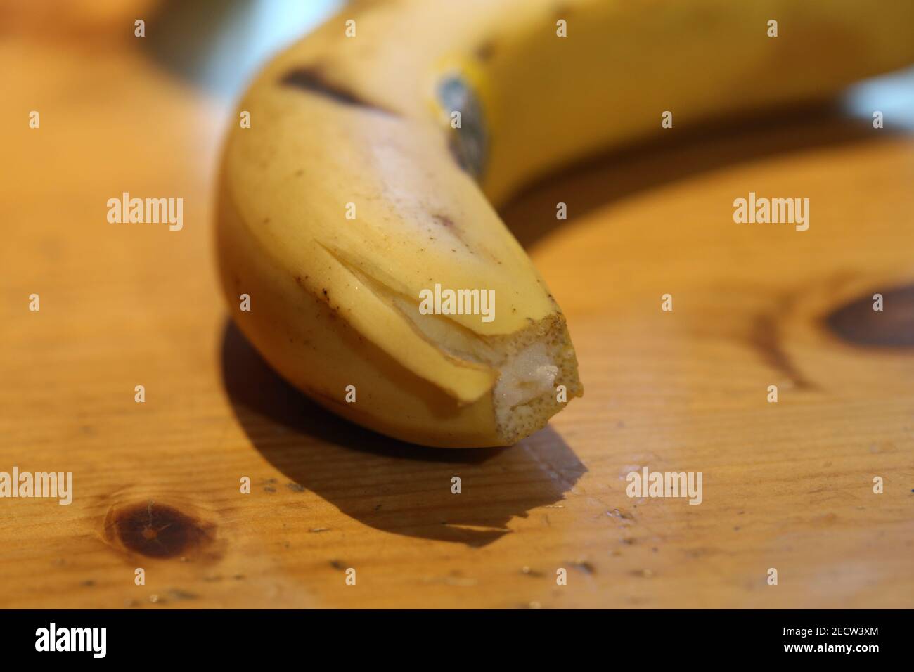 Closeup photo of a banana with rainforest alliance certificate that tells that the fruit has been farmed in a sustainable way. Healthy and delicious! Stock Photo