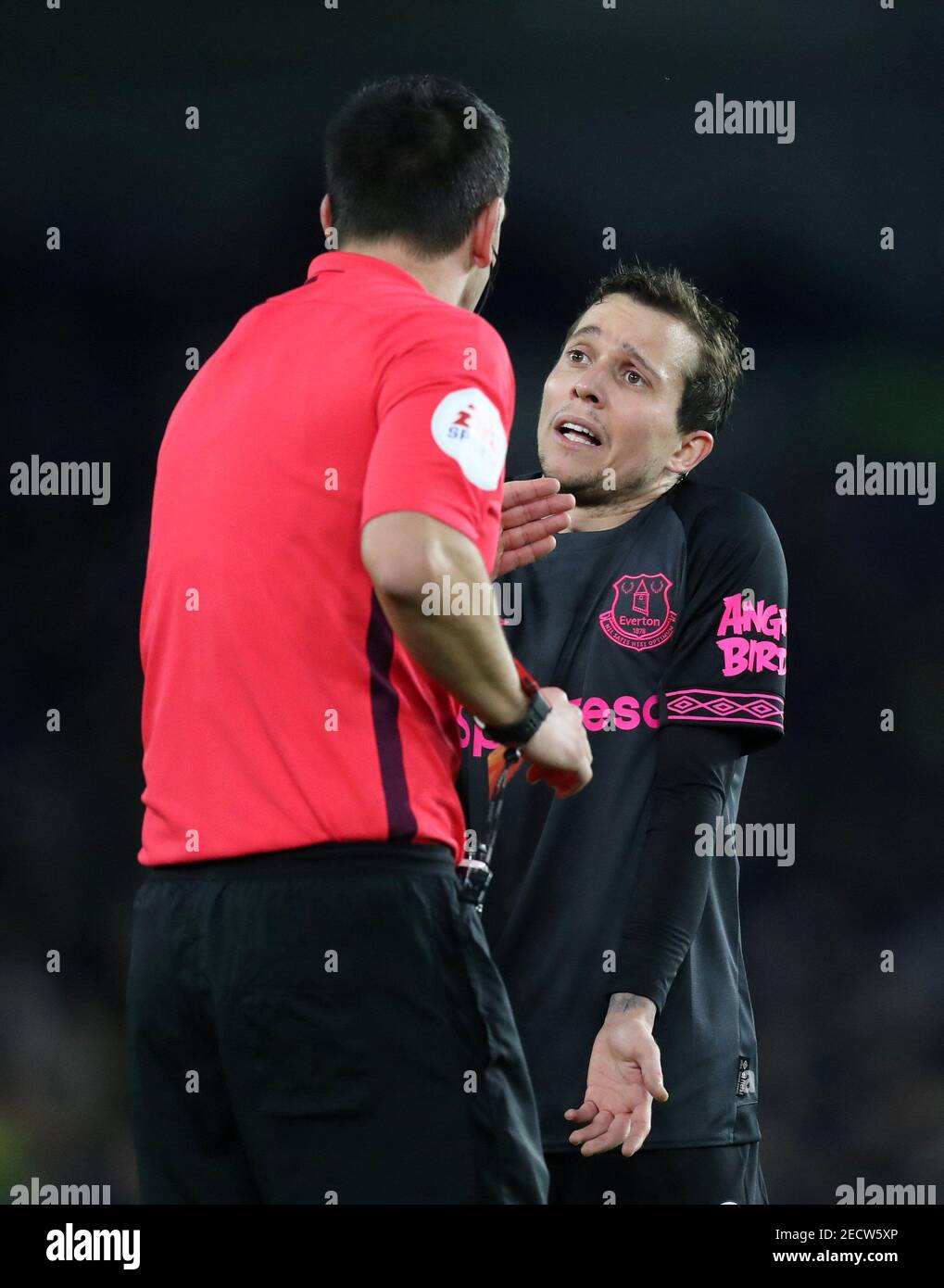 Soccer Football - Premier League - Brighton & Hove Albion v Everton - The American Express Community Stadium, Brighton, Britain - December 29, 2018  Everton's Bernard protests with referee Andrew Madley before being shown a yellow card        Action Images via Reuters/Peter Cziborra  EDITORIAL USE ONLY. No use with unauthorized audio, video, data, fixture lists, club/league logos or 'live' services. Online in-match use limited to 75 images, no video emulation. No use in betting, games or single club/league/player publications.  Please contact your account representative for further details. Stock Photo