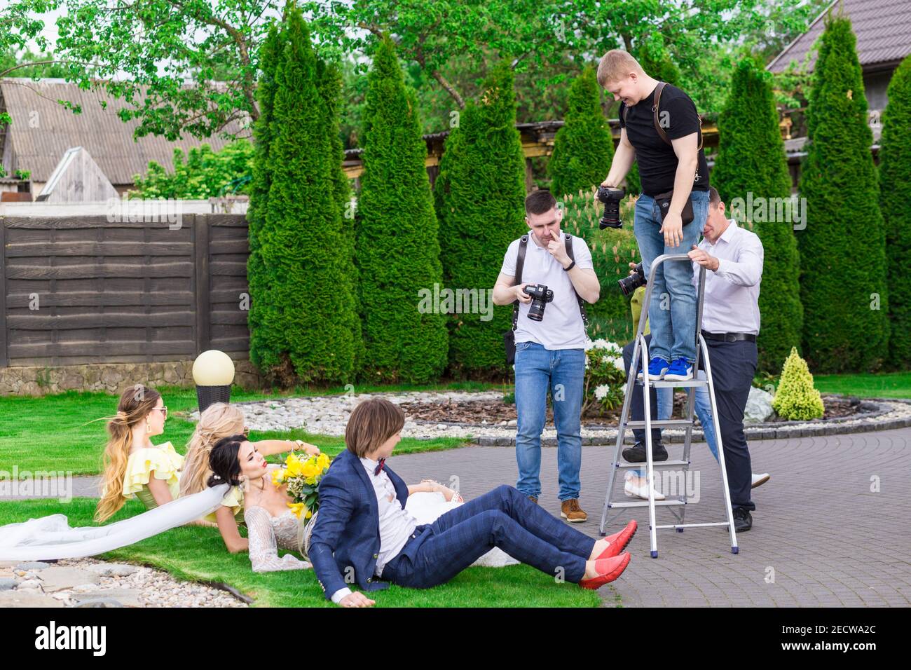 Aliaksandrava, Belarus - May 19, 2019: A professional photographer Uladzimir Sevastianau conducts a class on wedding photography for novice photograph Stock Photo