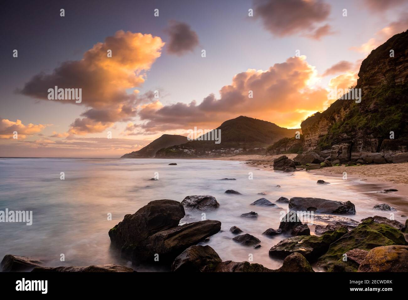 Sunset Clouds over Stanwell Park Beach and Community Stock Photo
