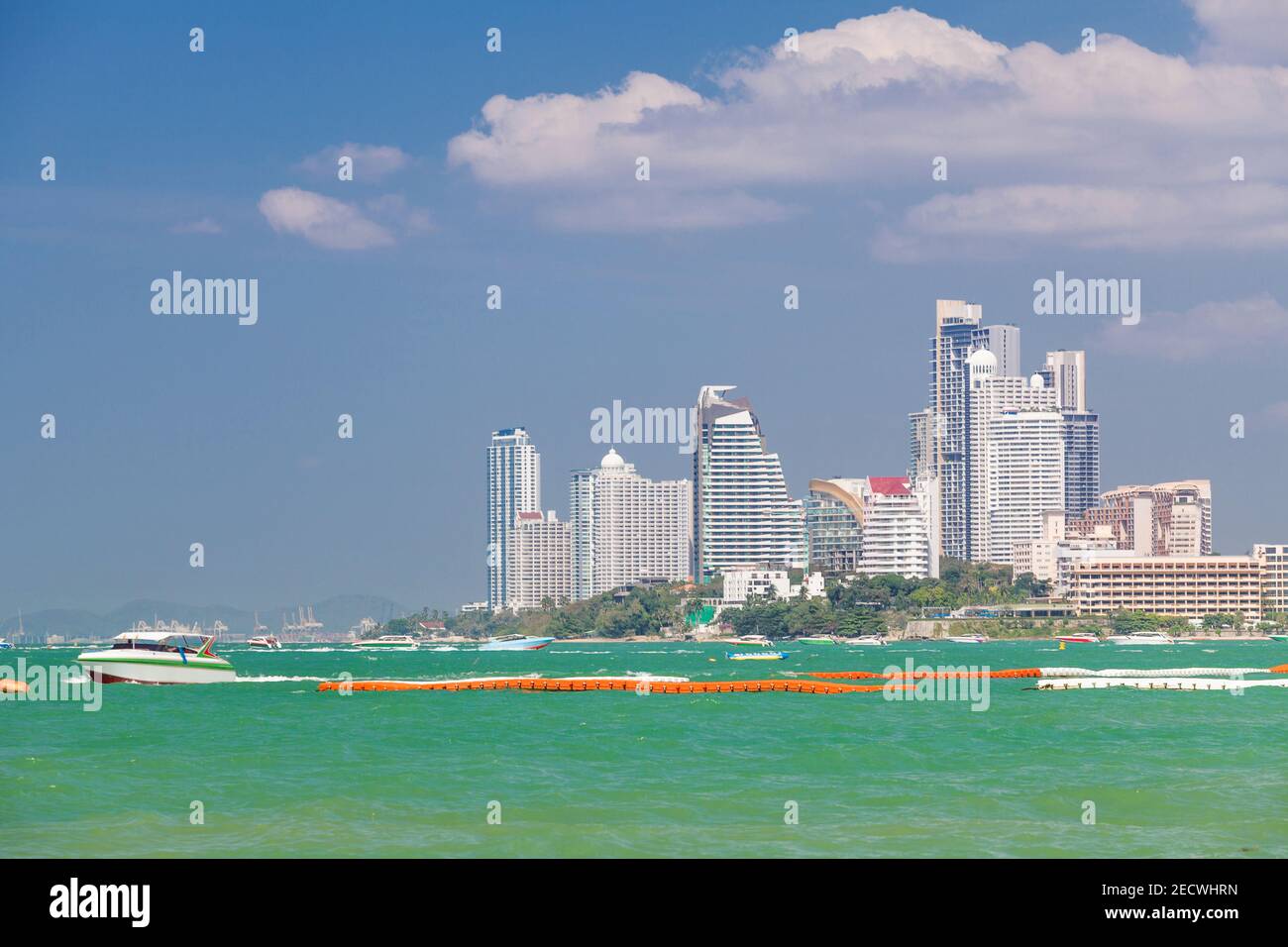 Background hotels and boats on turquoise water at Pattaya Beach, Thailand Stock Photo