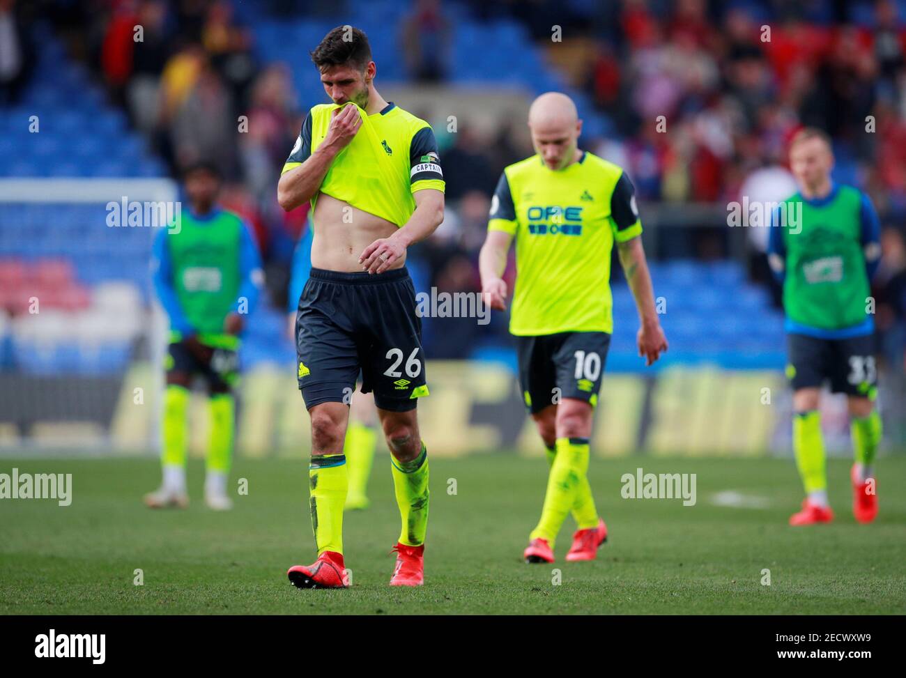 Soccer Football - Premier League - Crystal Palace v Huddersfield Town - Selhurst Park, London, Britain - March 30, 2019  Huddersfield Town's Christopher Schindler and Aaron Mooy look dejected after the match as they are relegated from the Premier League   Action Images via Reuters/Andrew Couldridge  EDITORIAL USE ONLY. No use with unauthorized audio, video, data, fixture lists, club/league logos or 'live' services. Online in-match use limited to 75 images, no video emulation. No use in betting, games or single club/league/player publications.  Please contact your account representative for fur Stock Photo