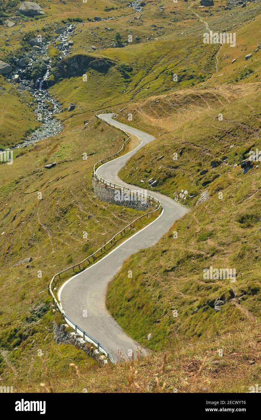 A top view of iconic winding curved road in Italy Piedmont Alps Stock ...