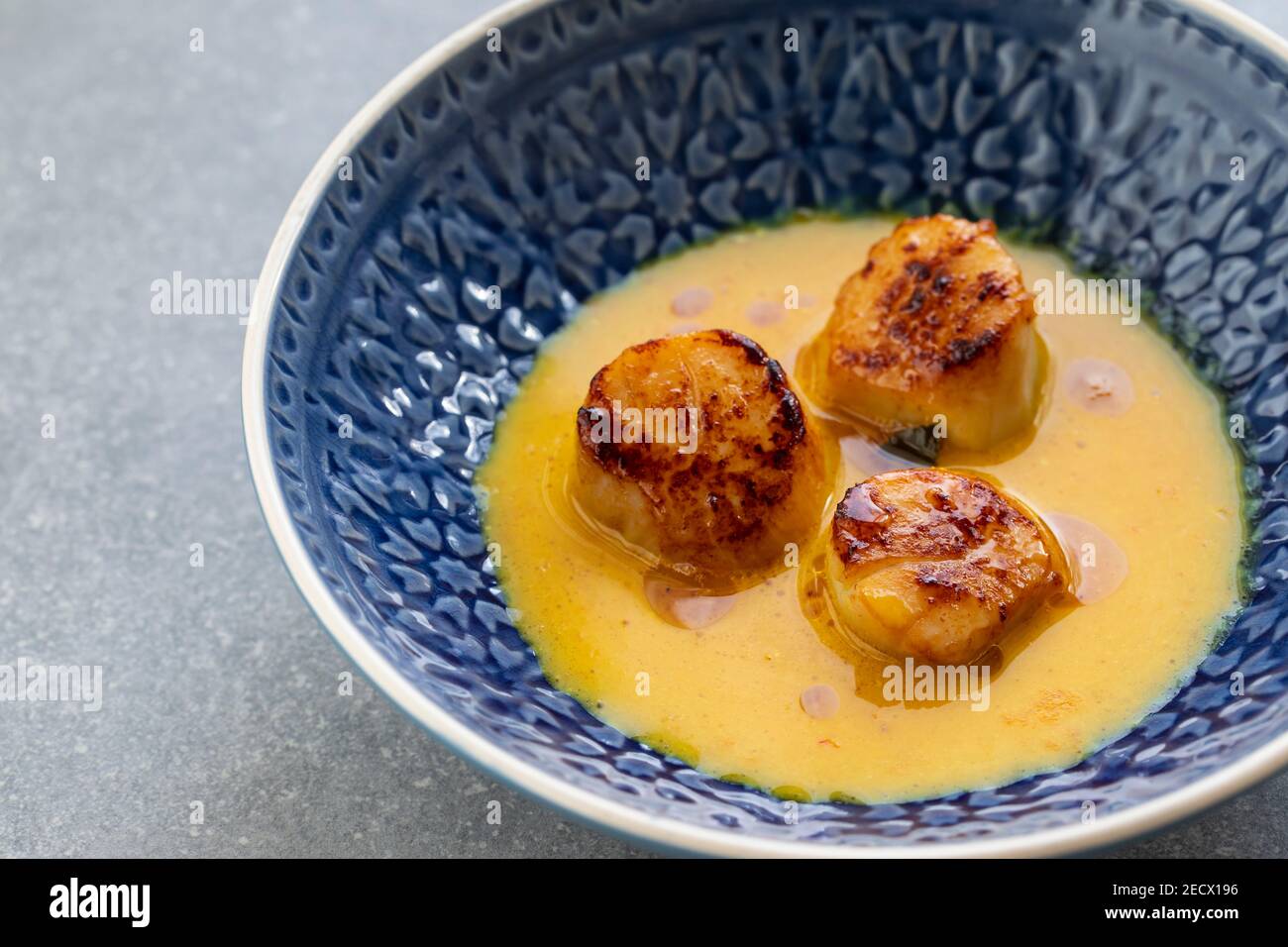 Scallops in spicy gulai sauce, Indonesian curry Stock Photo Alamy