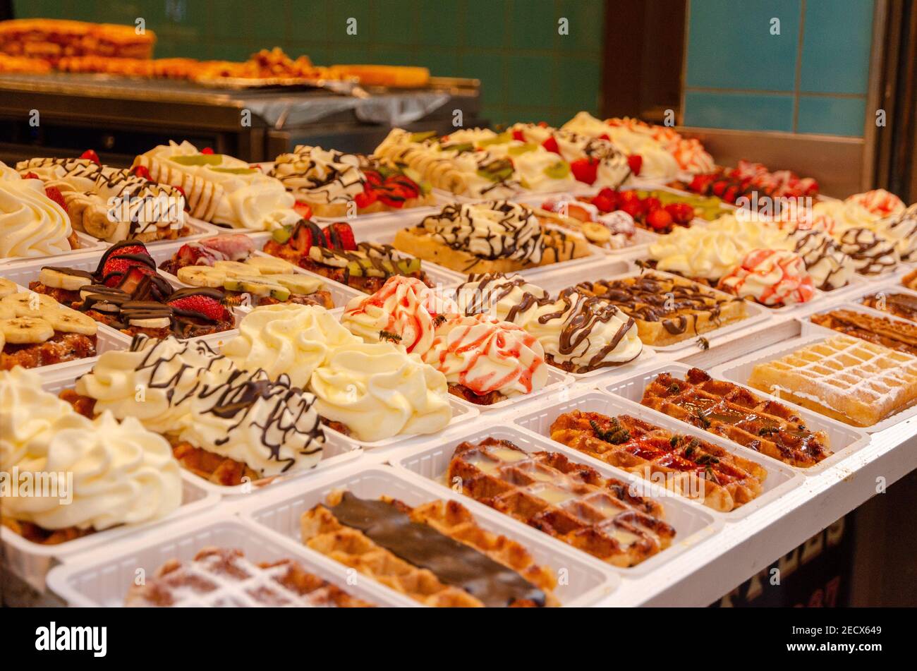 Belgian waffles street food with different toppings, fruits, sweets