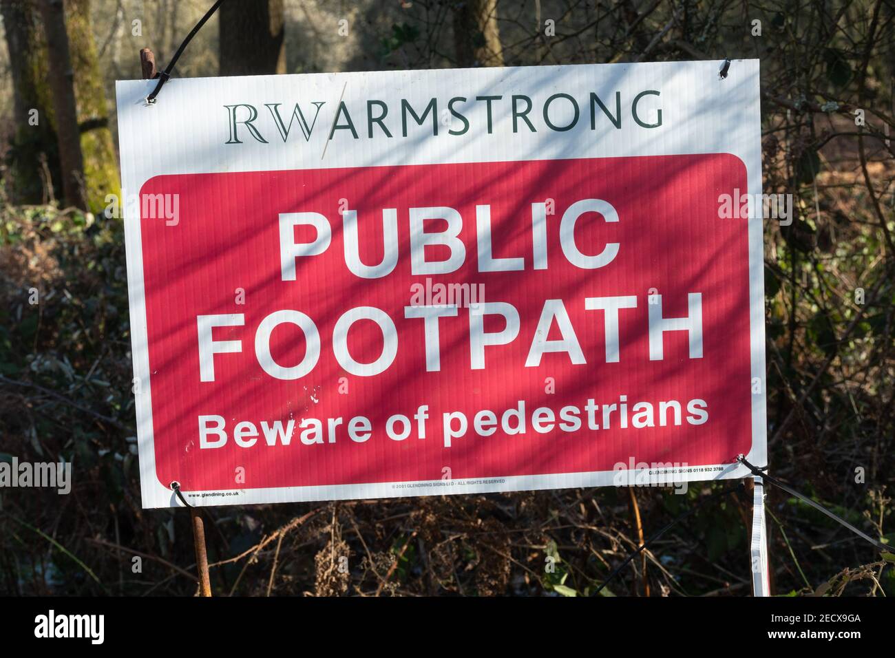 Sign warning Public Footpath, Beware of pedestrians, amusing sign Stock Photo