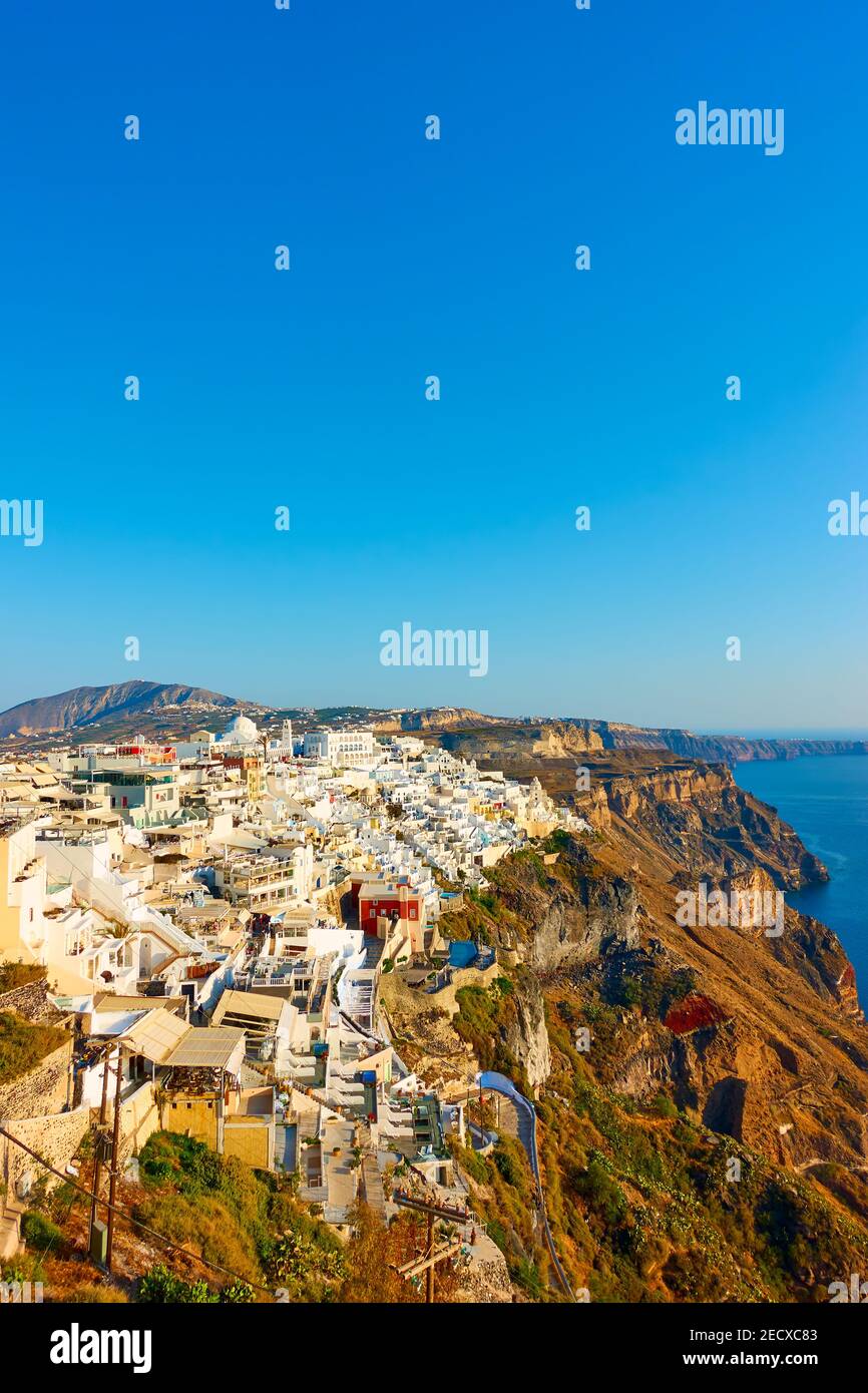 Greek landscape with Fira town on the coast of Santorini island in Greece and large space for your own text over the blue sky on the top Stock Photo