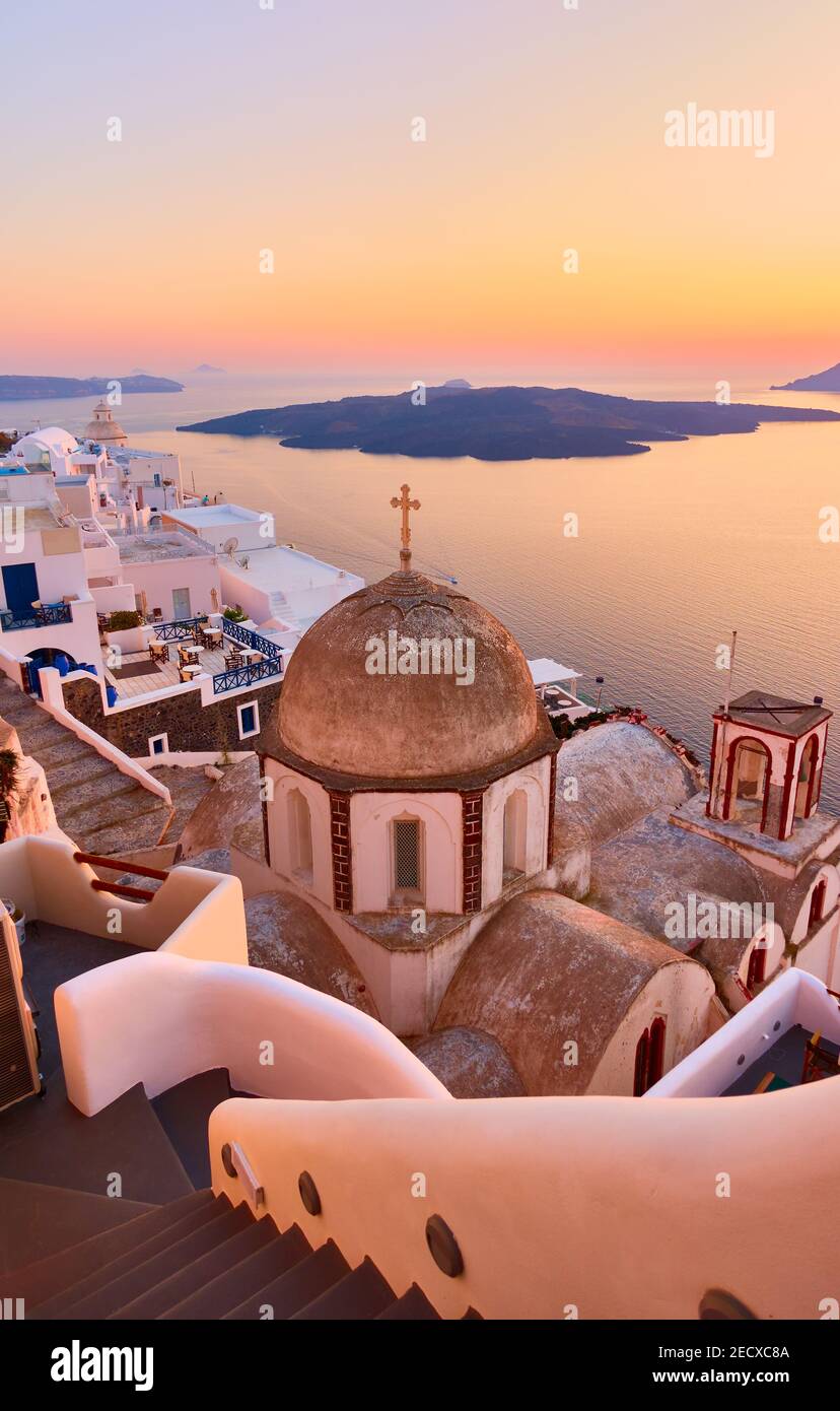 Greek landscape with Fira town on the coast of Santorini island by the sea at dusk, Greece Stock Photo