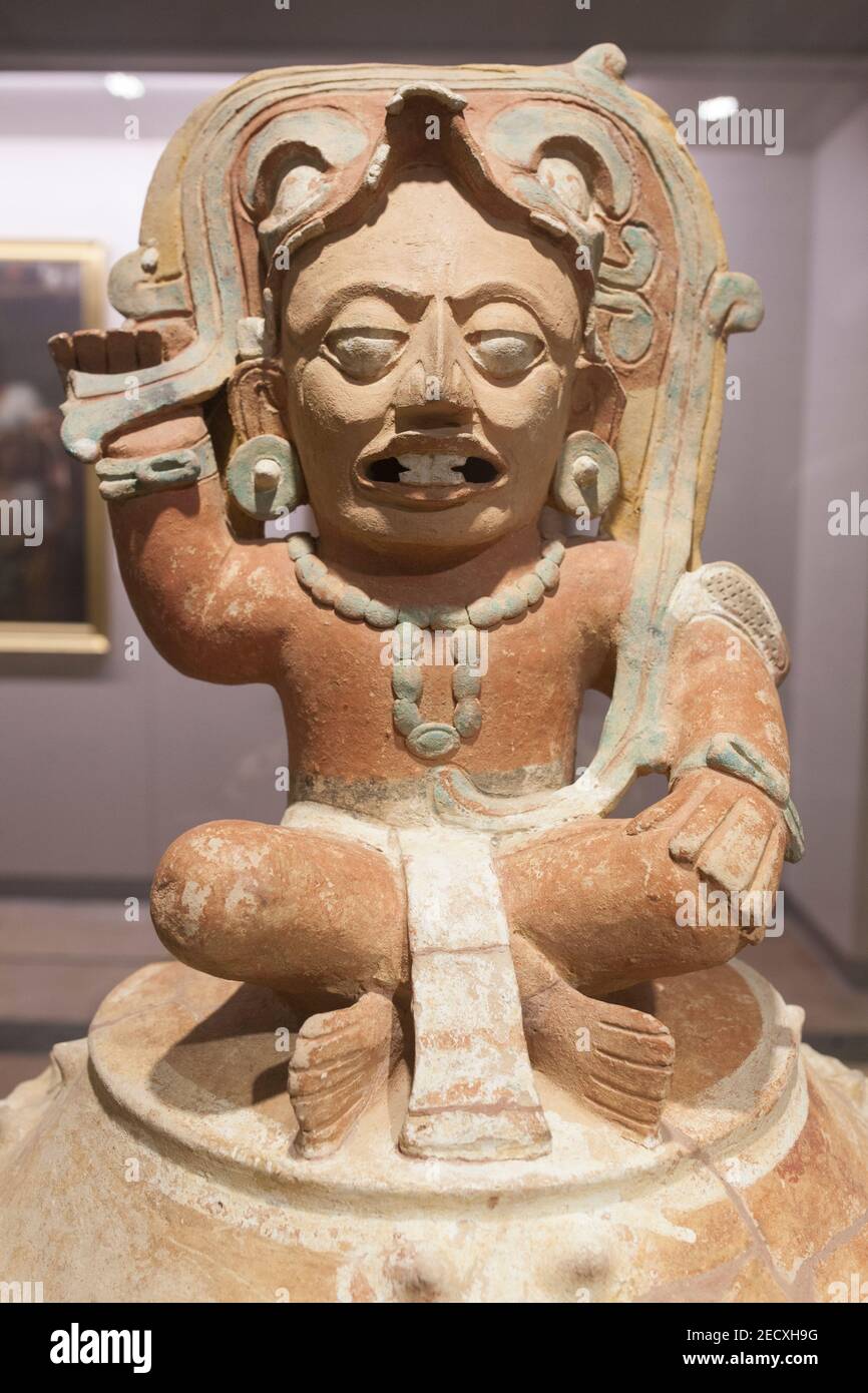 Madrid, Spain - Jul 11th, 2020: Funerary urn depicting Kinich Ahau Yucatec sun god. Mayan Culture, 600 AC. Museum of the Americas, Madrid, Spain Stock Photo