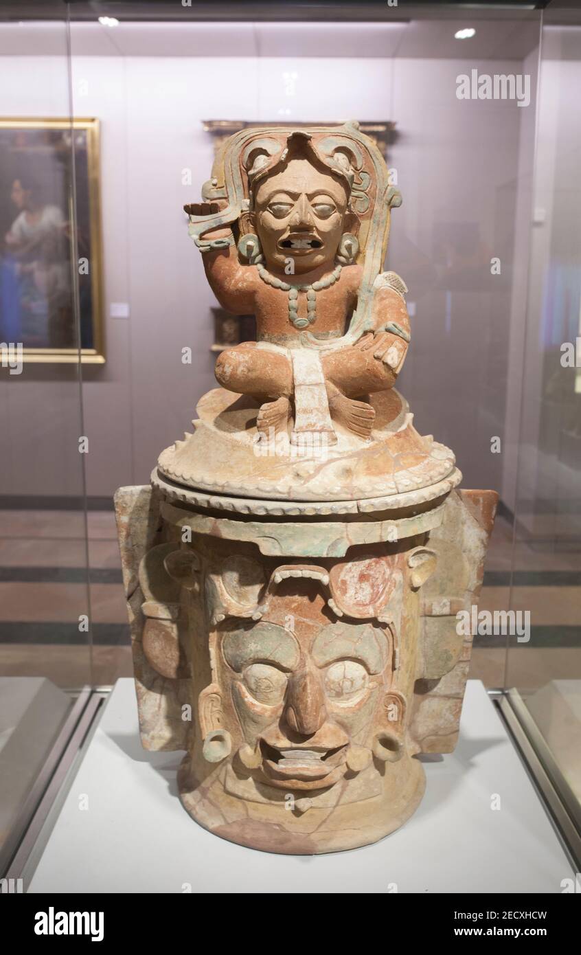 Madrid, Spain - Jul 11th, 2020: Funerary urn depicting Kinich Ahau Yucatec sun god. Mayan Culture, 600 AC. Museum of the Americas, Madrid, Spain Stock Photo