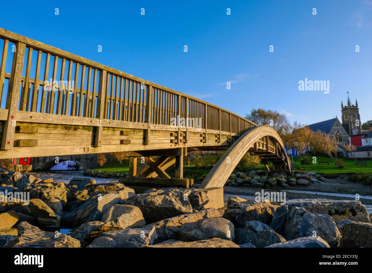 Wooden footbridge over the river Aeron, Aberaeron. Ceredigion. Wales. UK. Stock Photo