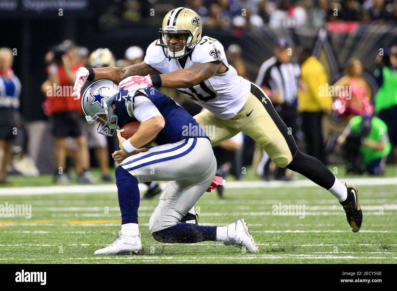 Oct 4, 2015; New Orleans, LA, USA; New Orleans Saints middle linebacker Stephone Anthony (50) sacks Dallas Cowboys quarterback Brandon Weeden (3) during the second quarter at the Mercedes-Benz Superdome. Mandatory Credit: Derick E. Hingle-USA TODAY Sports  / Reuters  Picture Supplied by Action Images   (TAGS: Sport American Football NFL) *** Local Caption *** 2015-10-05T021720Z 1104858449 NOCID RTRMADP 3 NFL-DALLAS-COWBOYS-AT-NEW-ORLEANS-SAINTS.JPG Stock Photo