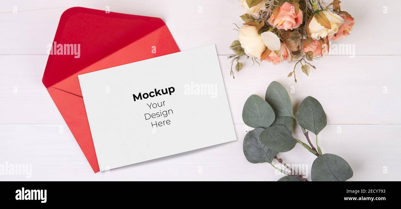 Valentine day, greeting card mockup size a5 and letter and flower on wooden table, postcard blank and letter with romance on desk, present in annivers Stock Photo