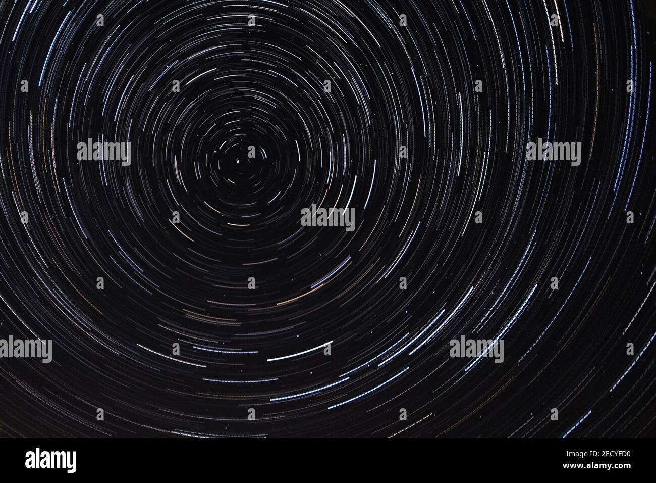 Long exposure starry sky, twisted tracks of stars. Starry sky background  picture of stars in the night sky and the Milky Way Stock Photo - Alamy