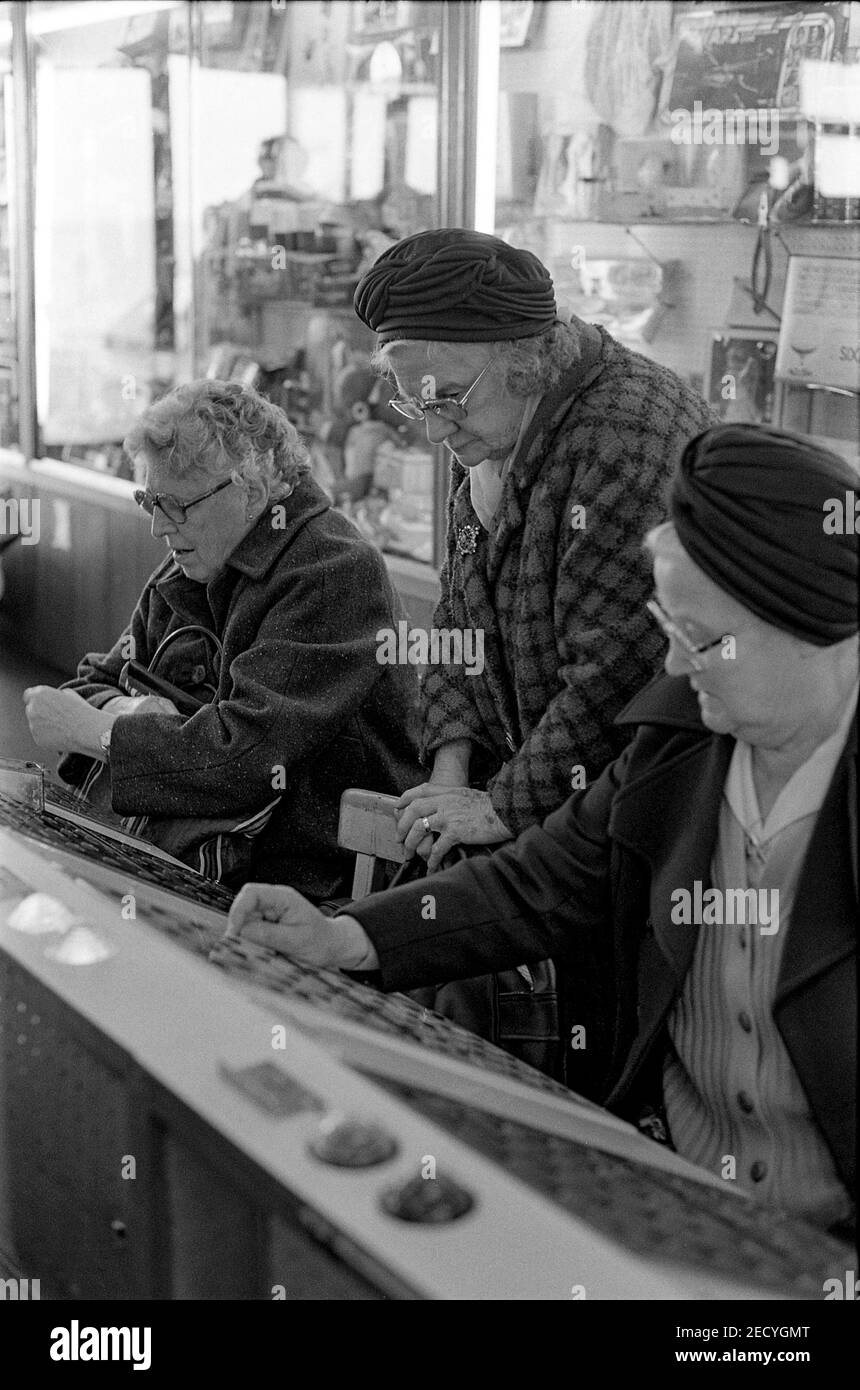 Three women playing Prize Bingo Stock Photo