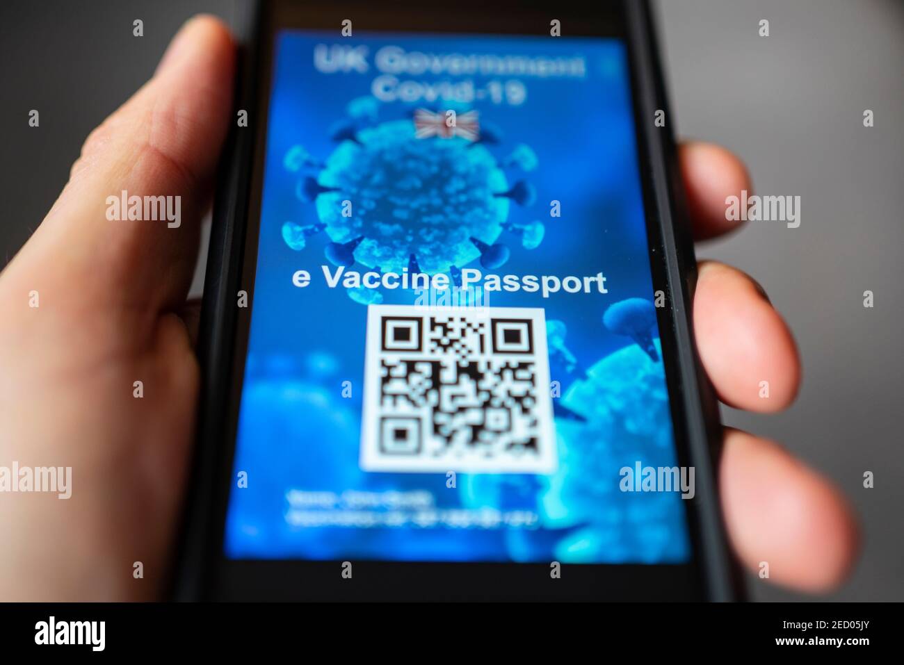 Conceptual design of possible UK electronic Covid-19 vaccination passport using QR code on a smart phone. Stock Photo