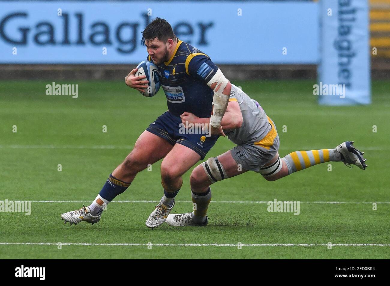 Worcester, UK. 14th Feb, 2021. Ethan Waller of Worcester Warriors is tackled by James Gaskell of Wasps in Worcester, UK on 2/14/2021. (Photo by Craig Thomas/News Images/Sipa USA) Credit: Sipa USA/Alamy Live News Stock Photo