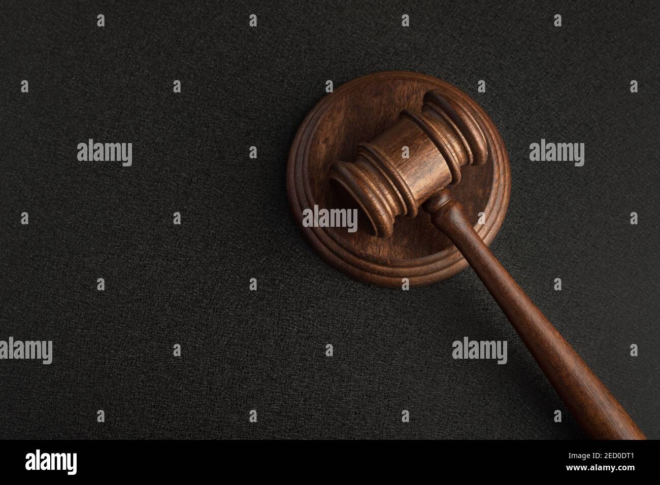 Wooden judge gavel and sound Board. Top view. Auction. Black background