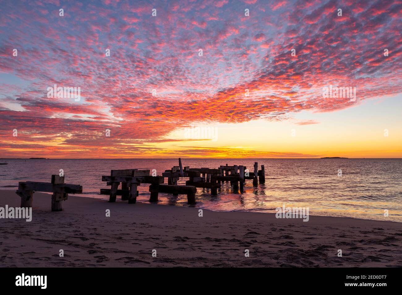 Colourful Cirrocumulus clouds at sunset over Jurien Bay Jetty Stock Photo