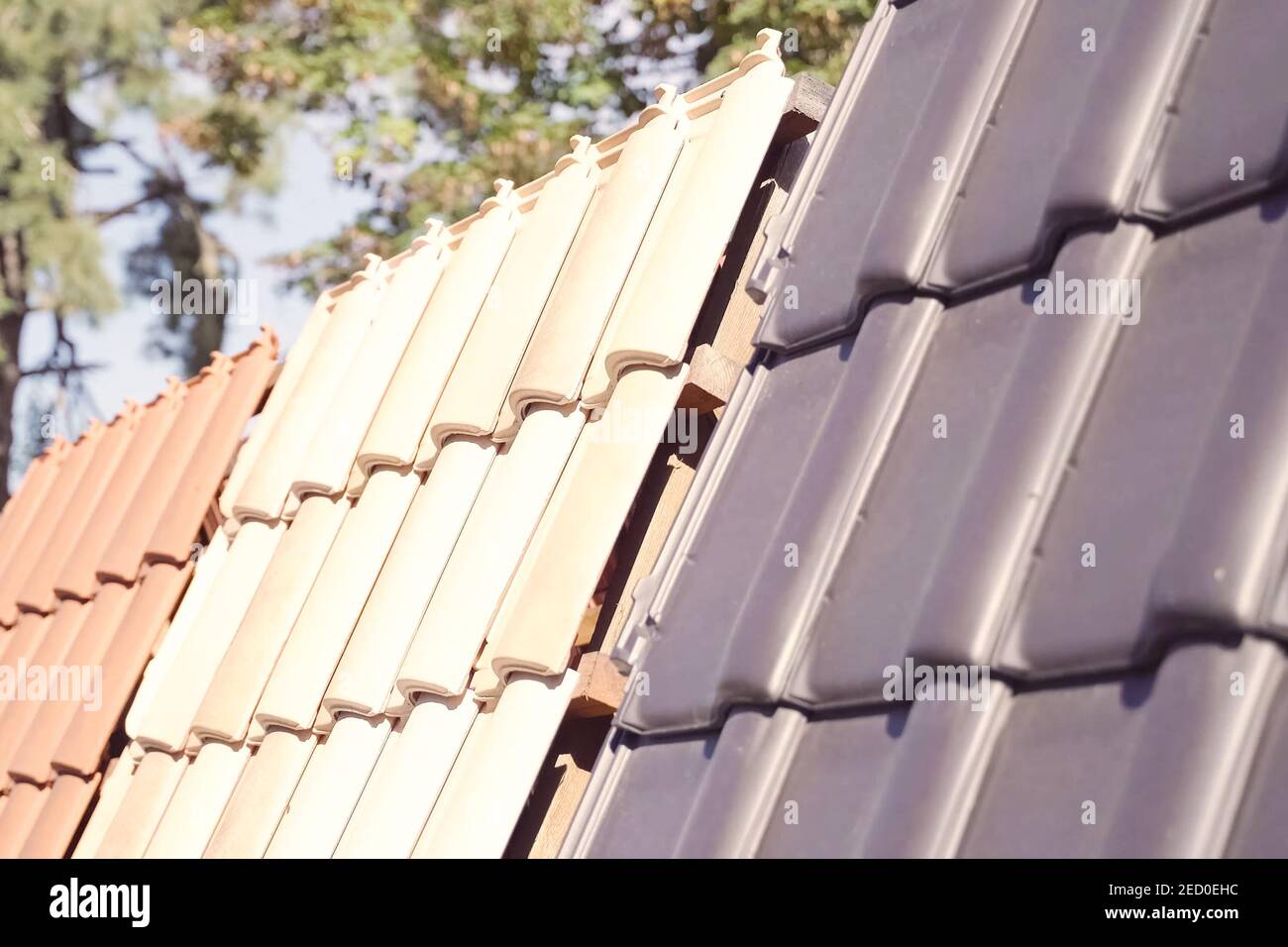 Samples of ceramic roofing tiles in a warehouse of a roofing materials store. Modern roof made